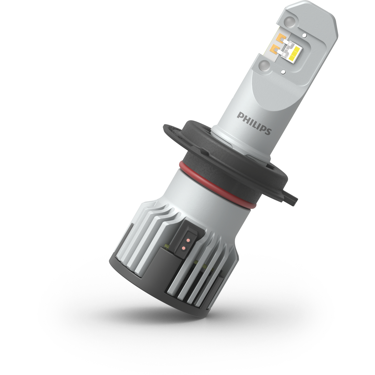 Eine weiße Philips LED-Lampe mit Kühlrippen und einem schwarzen Stecker.