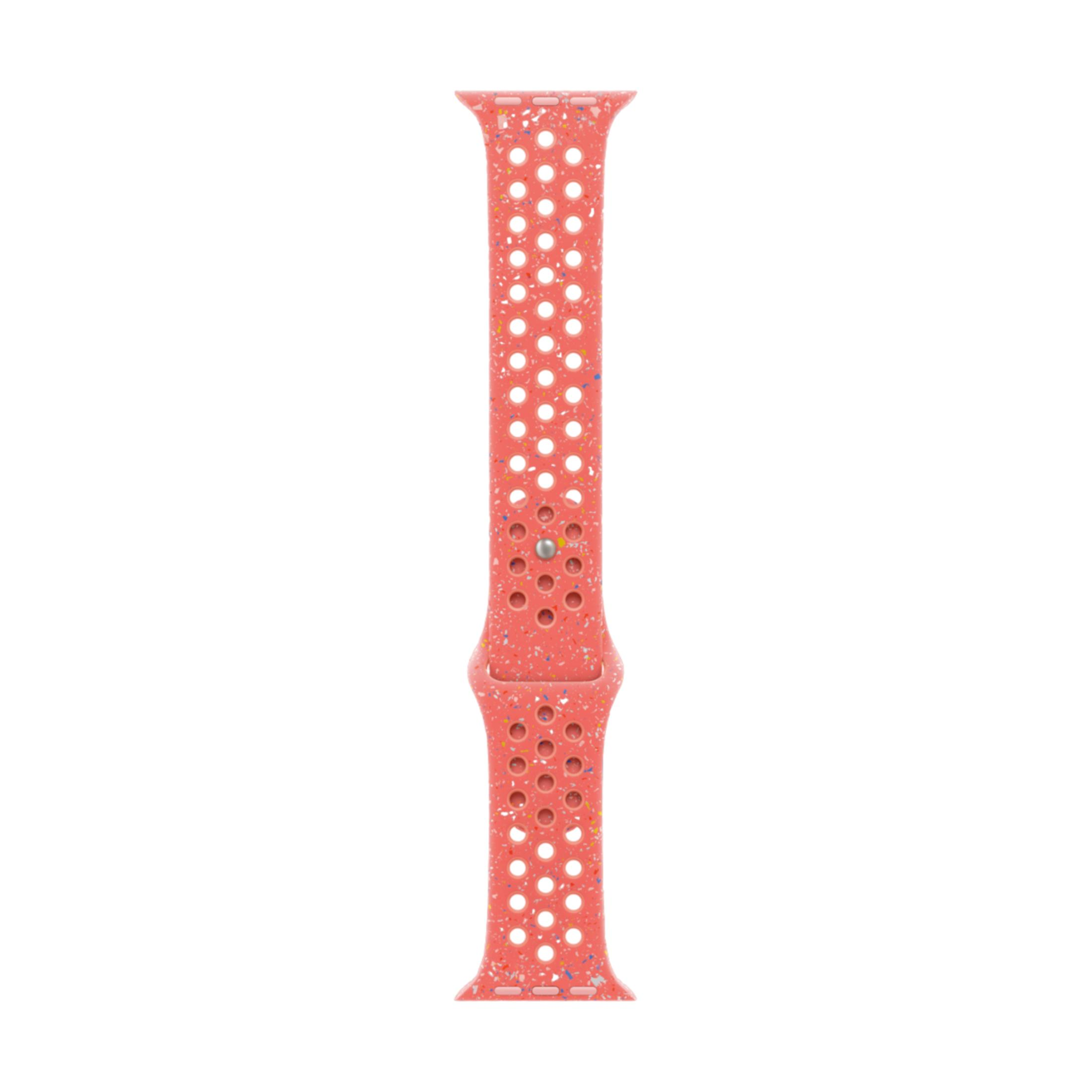 A coral-colored watch band with white circular perforations and multi-colored speckles.