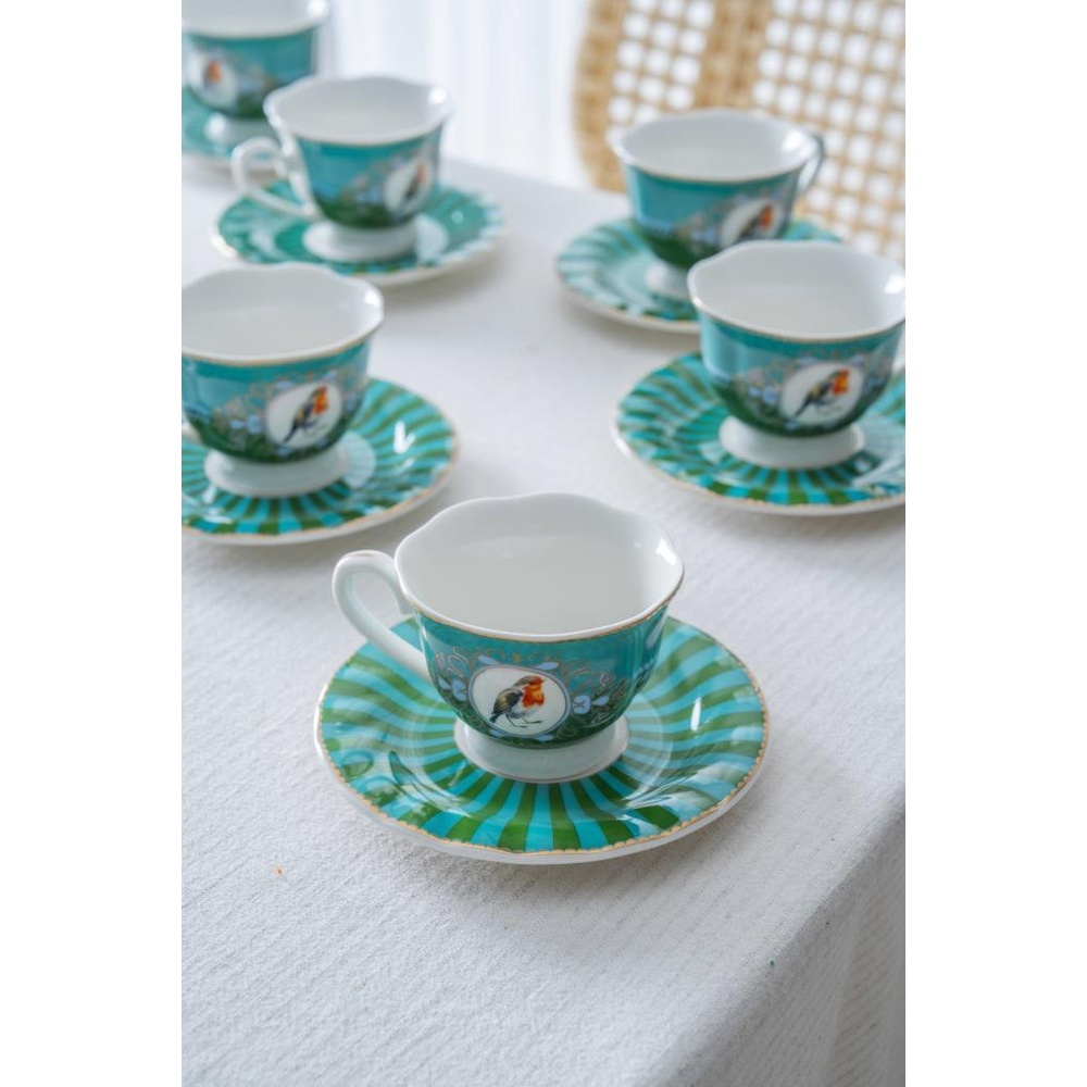 Kuş motifli turkuaz çay fincanı ve tabağı seti.