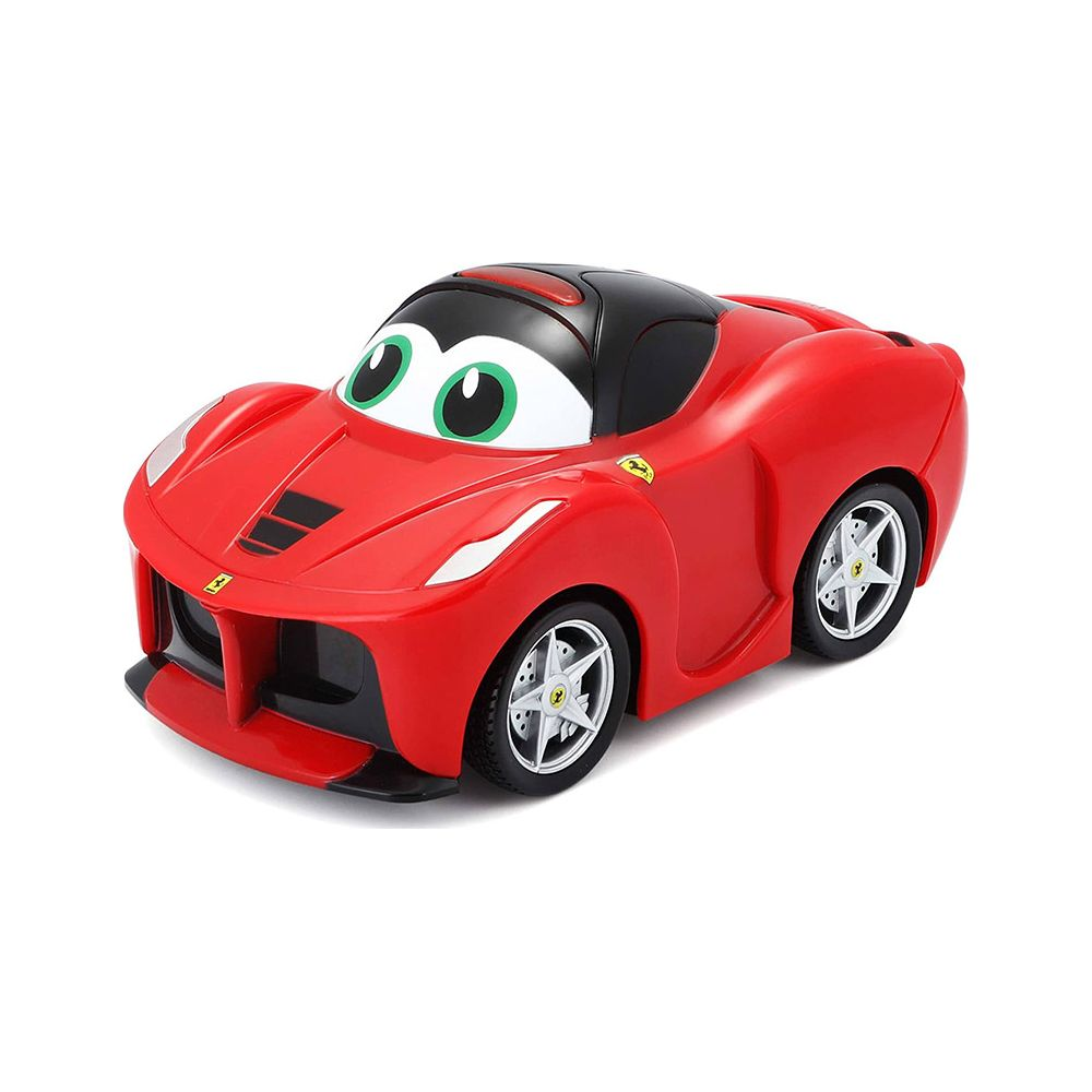 Une voiture jouet rouge avec de grands yeux verts et des accents noirs.