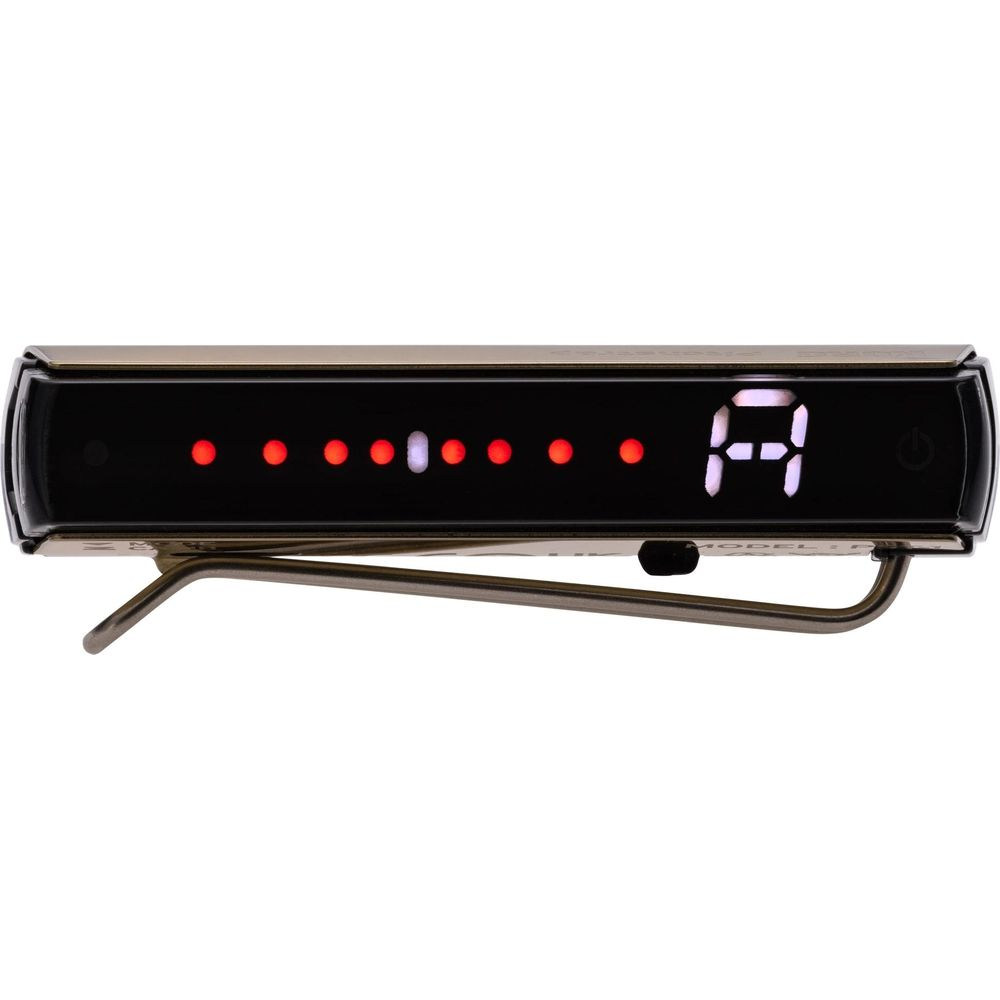 Eine digitale Gitarrenstimmhilfe mit roter und weißer LED-Anzeige und einem silbernen Clip.