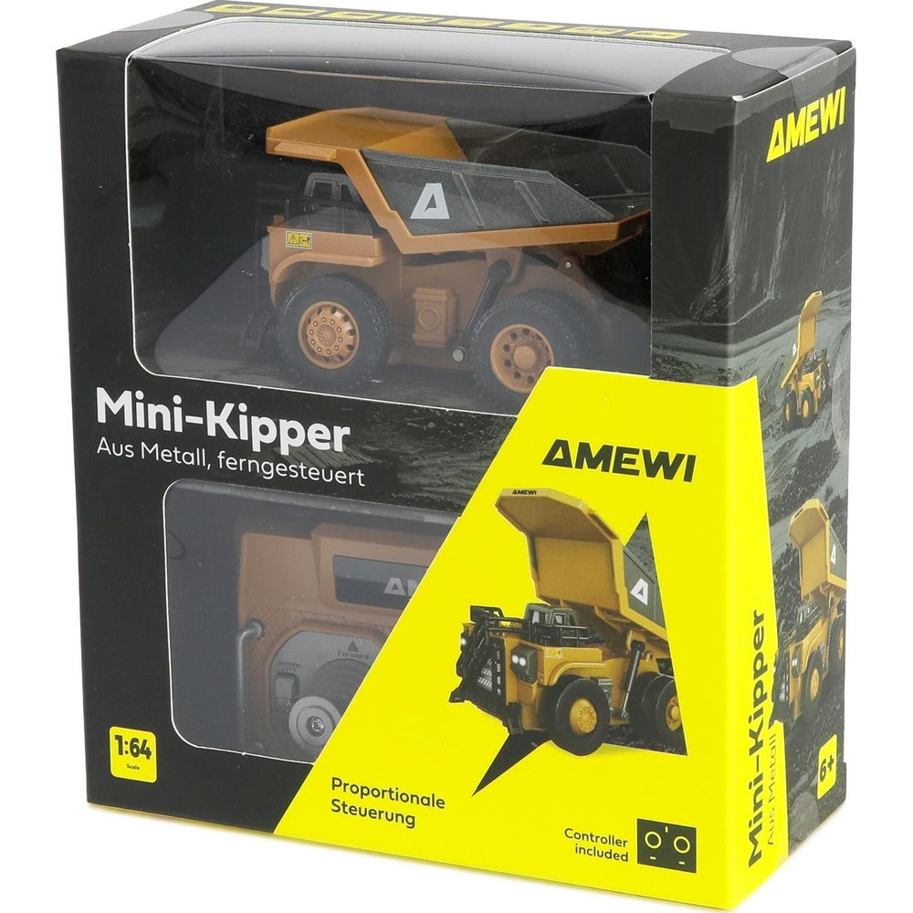 Un camion benne jouet dans sa boîte. Le camion est jaune et noir avec un logo A.