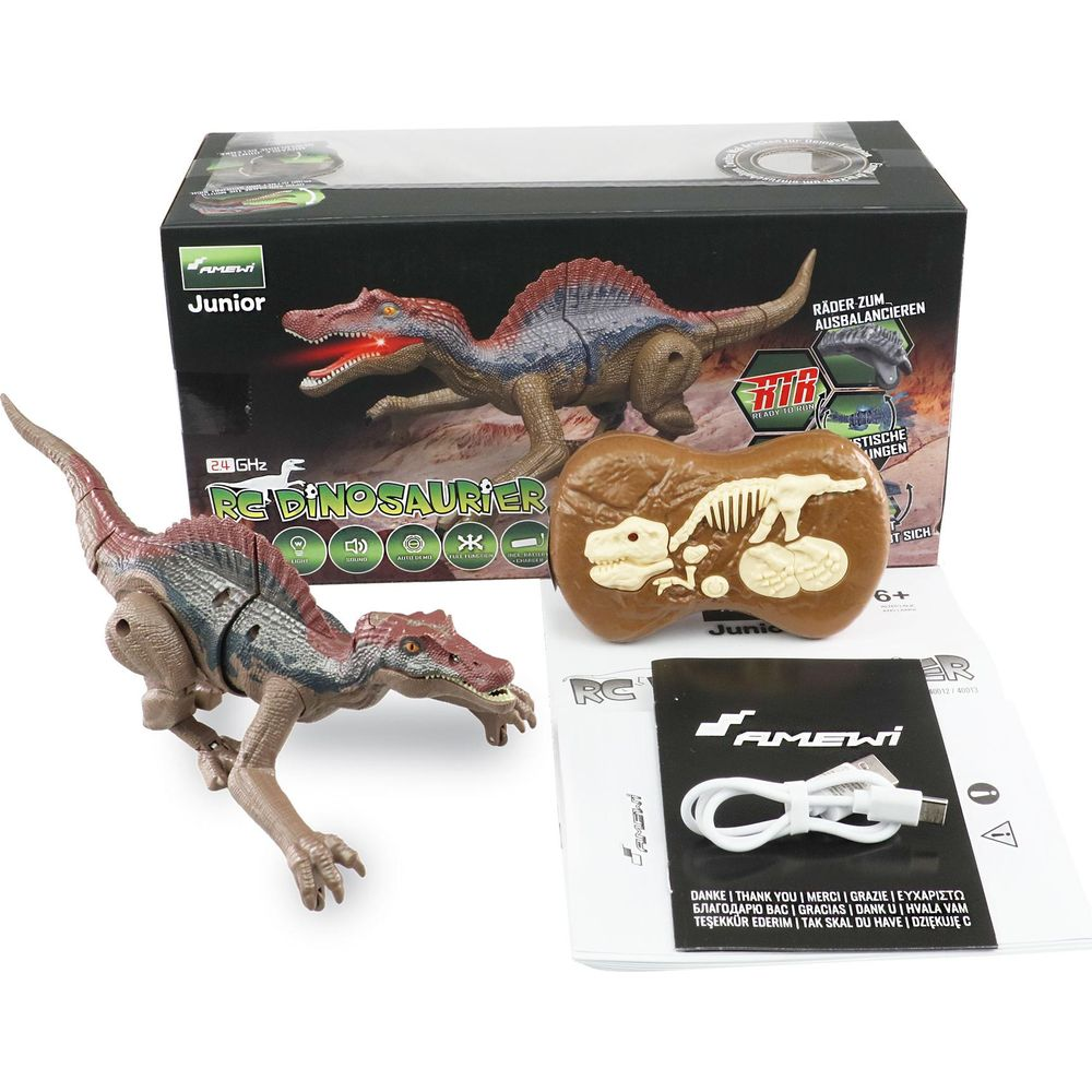 Ein RC-Dinosaurier mit Fernbedienung, Ladekabel und Anleitung.