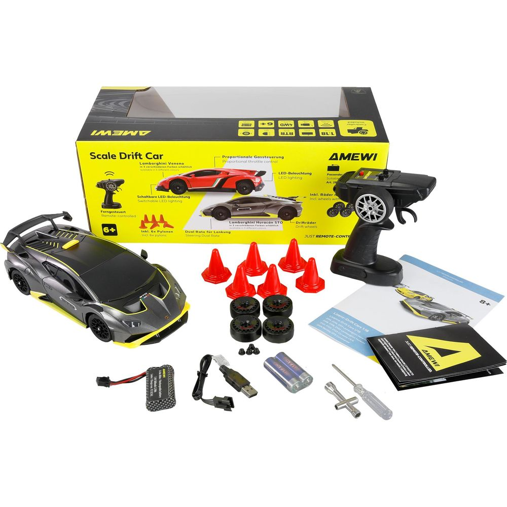 Un set de coche de deriva a control remoto con coches, mando, ruedas, conos y accesorios.