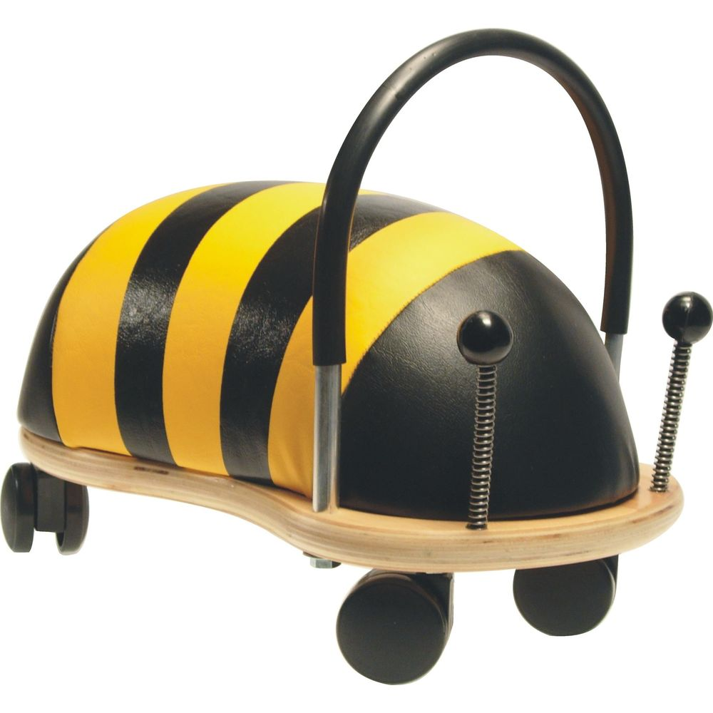Ein bienenförmiges Lauflernspielzeug mit schwarz-gelben Streifen und schwarzem Griff.