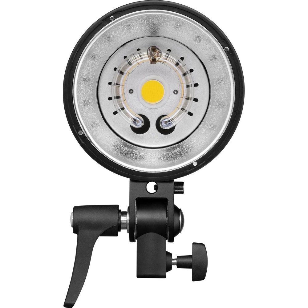 Nahaufnahme eines Studioblitzkopfes mit silbernem Reflektor und LED-Licht.