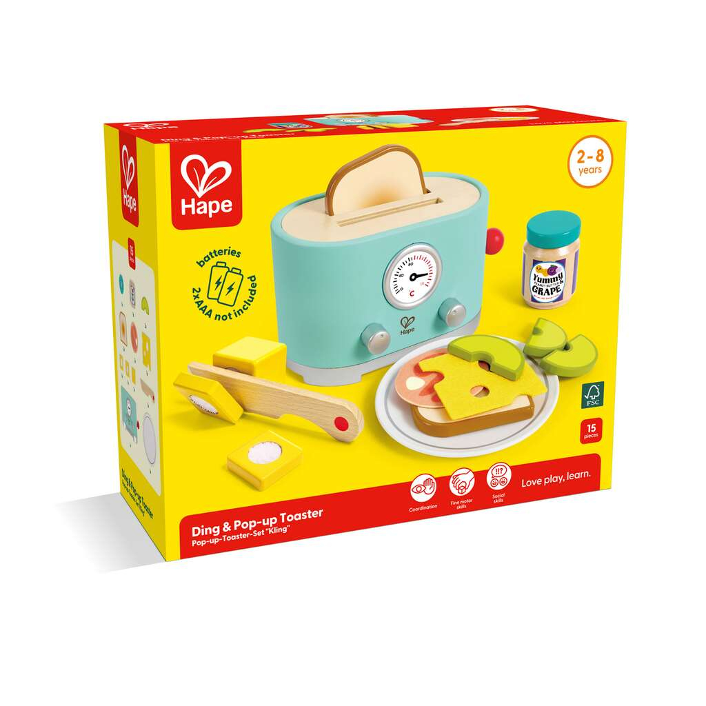 Un set giocattolo tostapane Hape con pane, fette di formaggio e barattolo di marmellata su scatola gialla.
