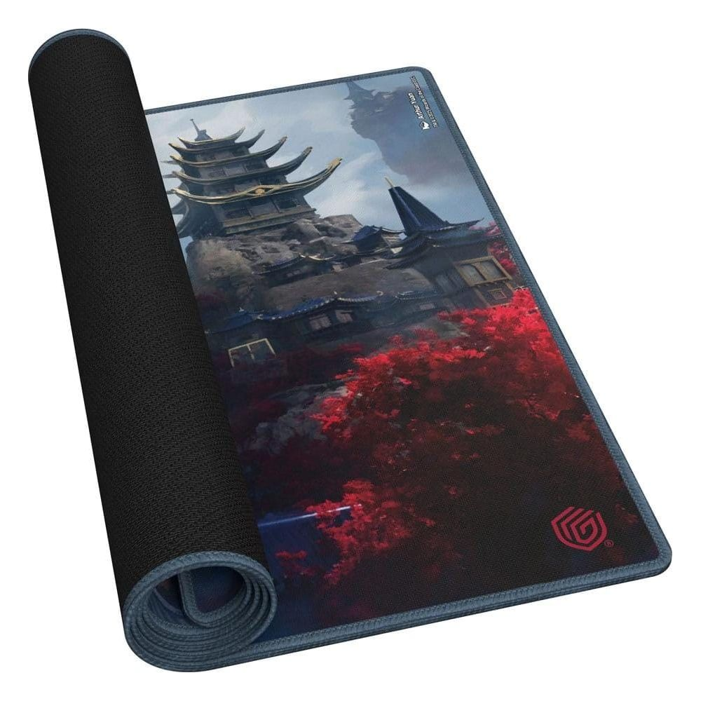 Un tapis de souris roulé montre un paysage de montagne avec des pagodes et des arbres rouges.
