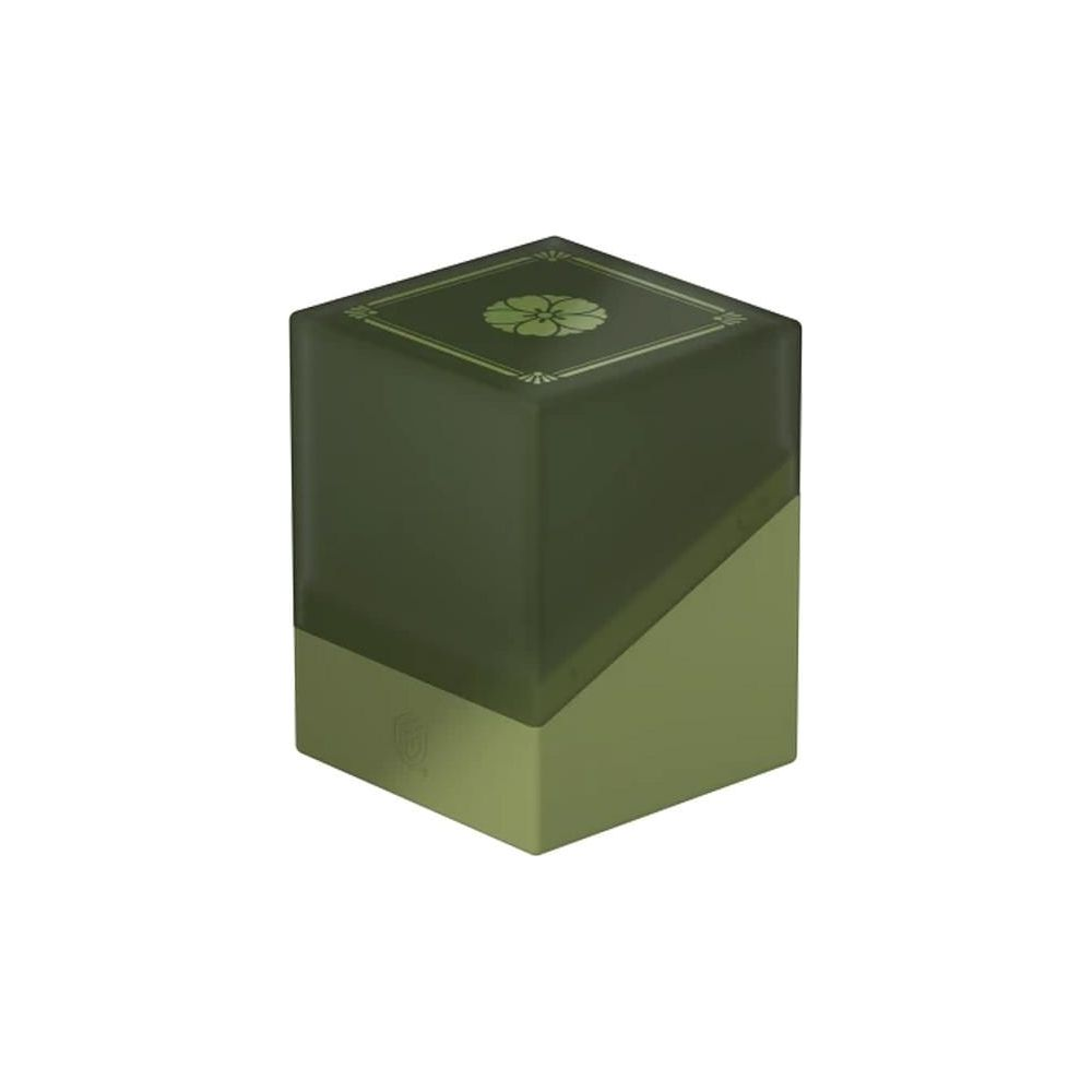 Un cube vert foncé avec un motif floral vert clair sur le dessus.