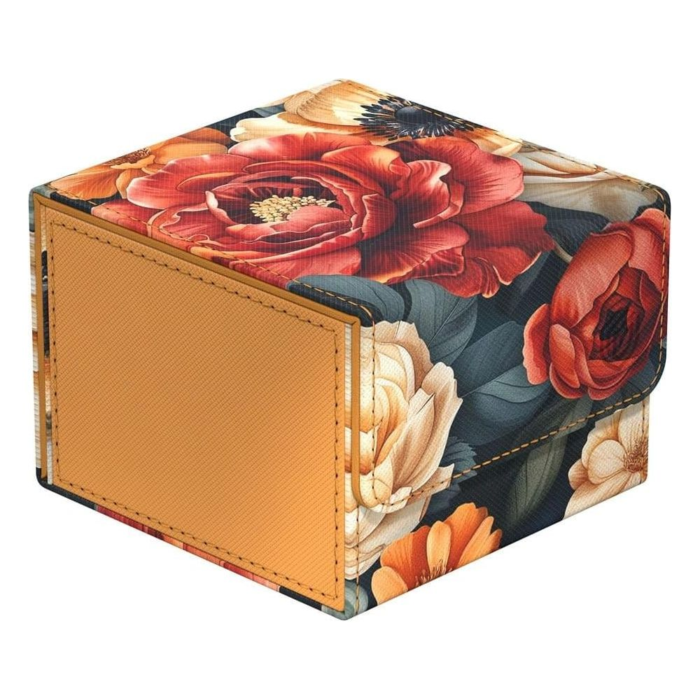 Une boîte carrée décorée d'un motif floral aux teintes rouges, oranges et crème.