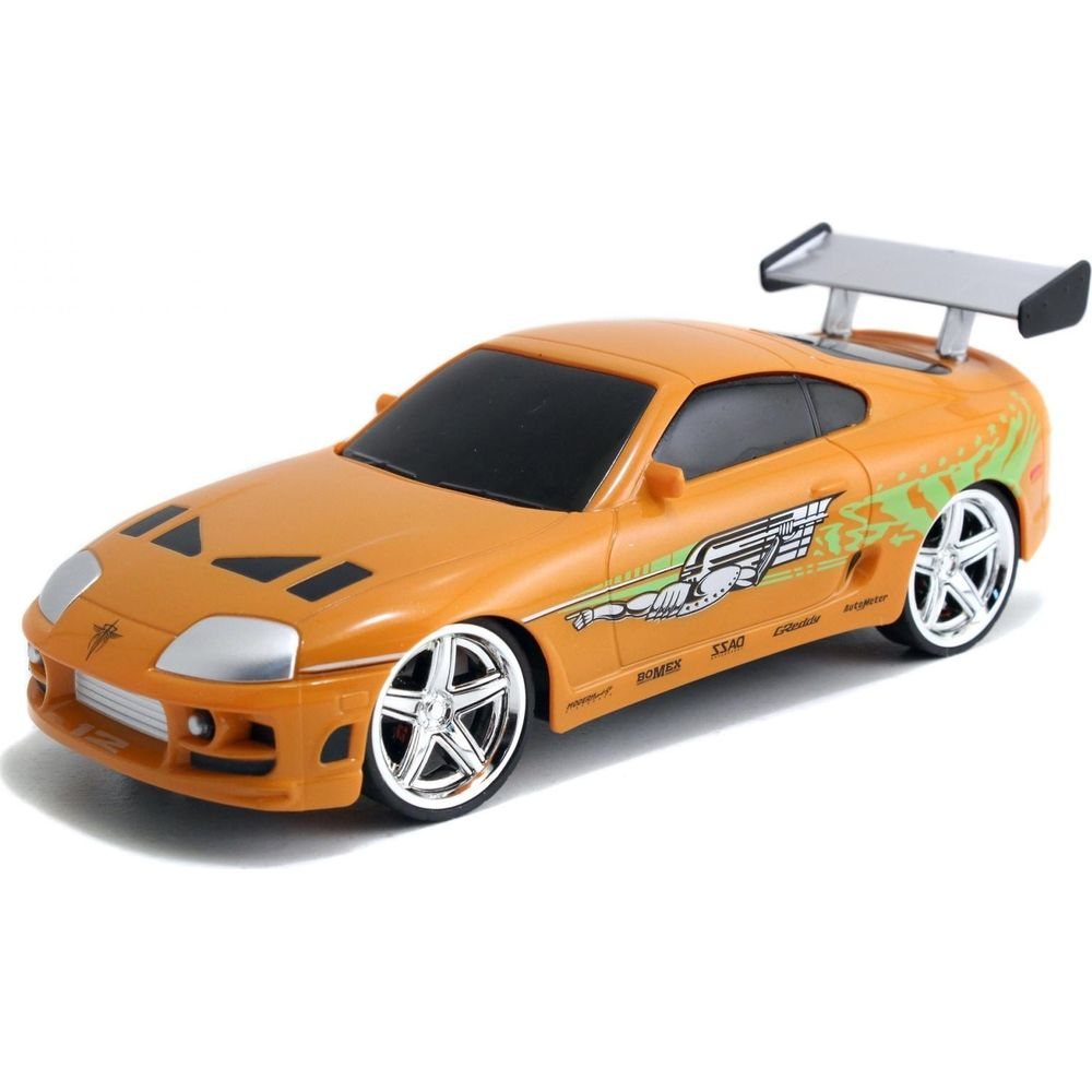 Ein orangefarbenes Spielzeugauto mit einem großen Spoiler und Aufklebern.