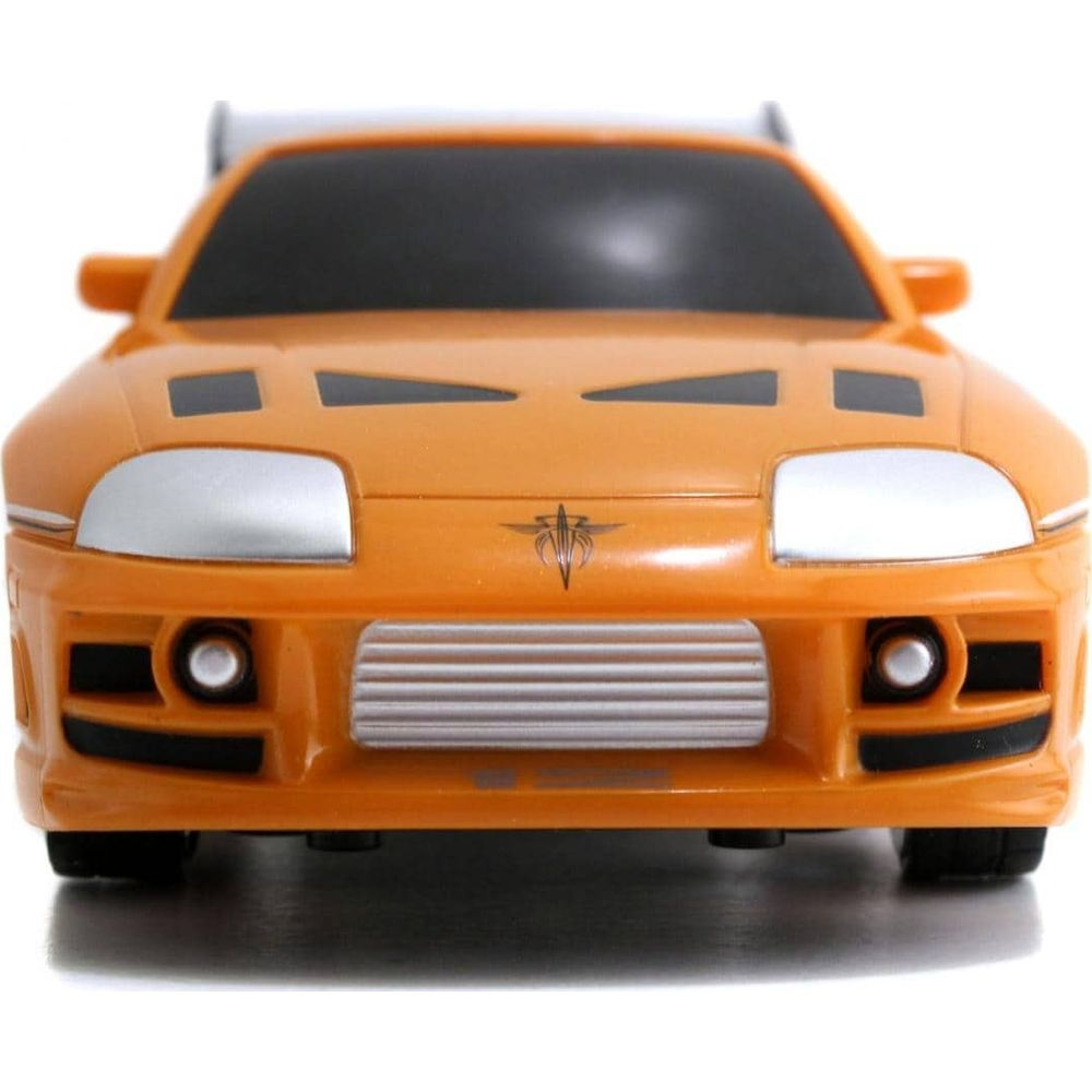 Ein orangefarbenes Spielzeugauto mit einem Spoiler und einem Kühlergrill.