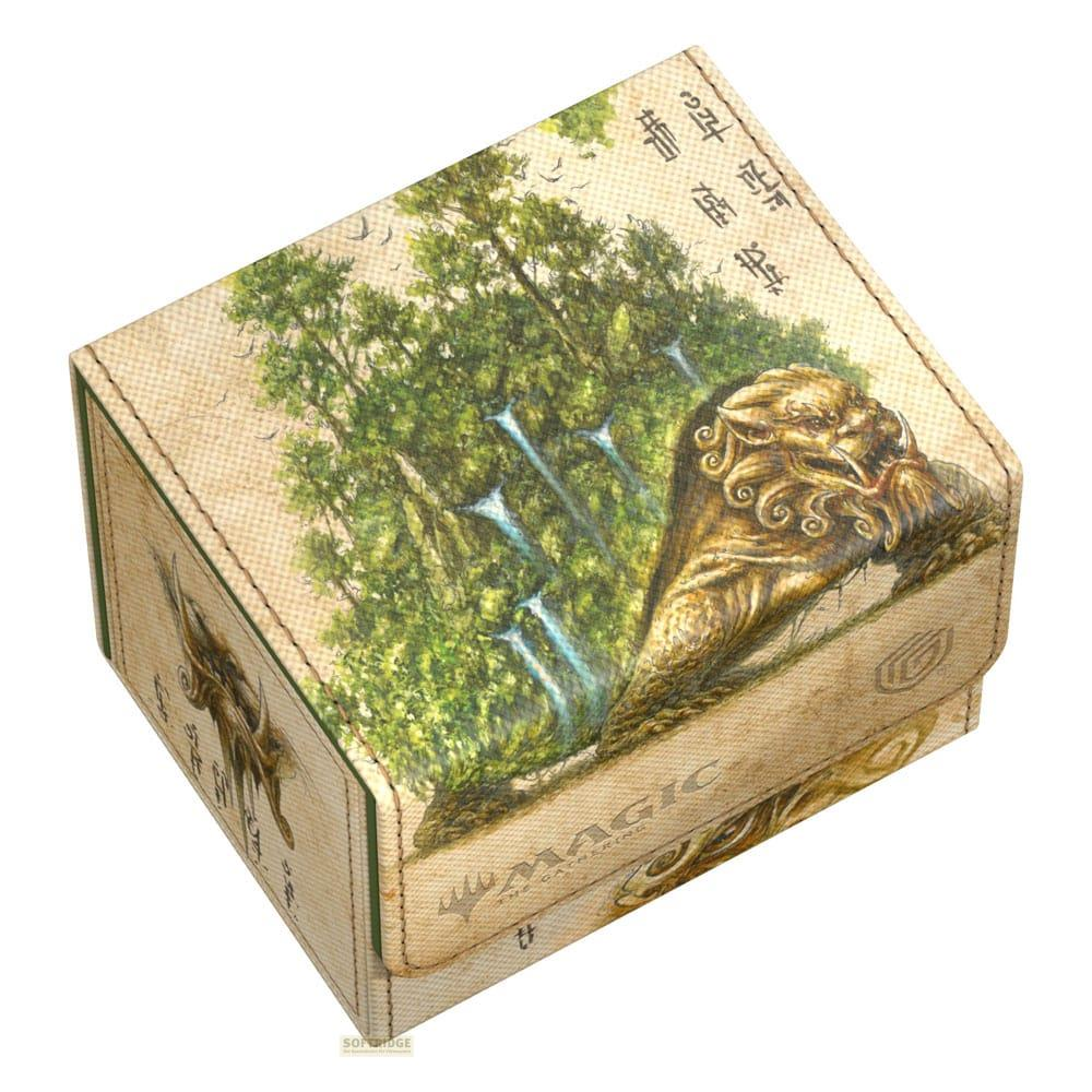 Une boîte représentant une scène de forêt et un motif de tête de lion style asiatique.