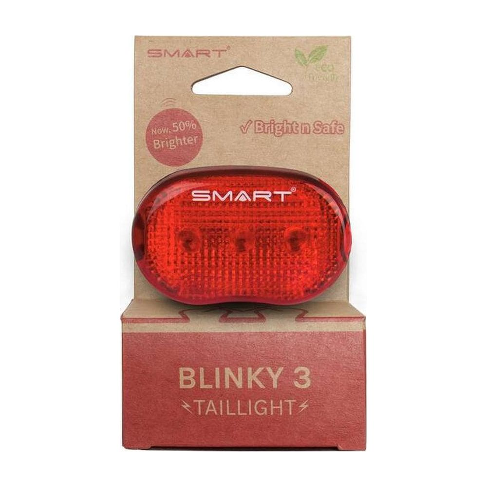 Una luce posteriore rossa per bicicletta marca SMART nella sua confezione. Testo: Blinky 3 Taillight.