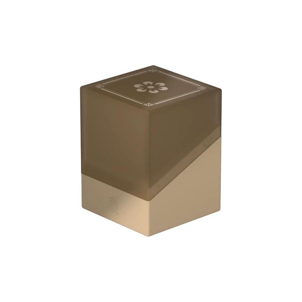 Cube ambré translucide avec motif floral sur le dessus et base dorée inclinée.