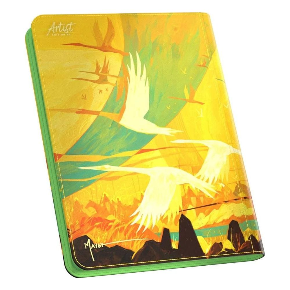 Couverture de carnet vert avec des grues blanches volant dans un ciel jaune et vert.