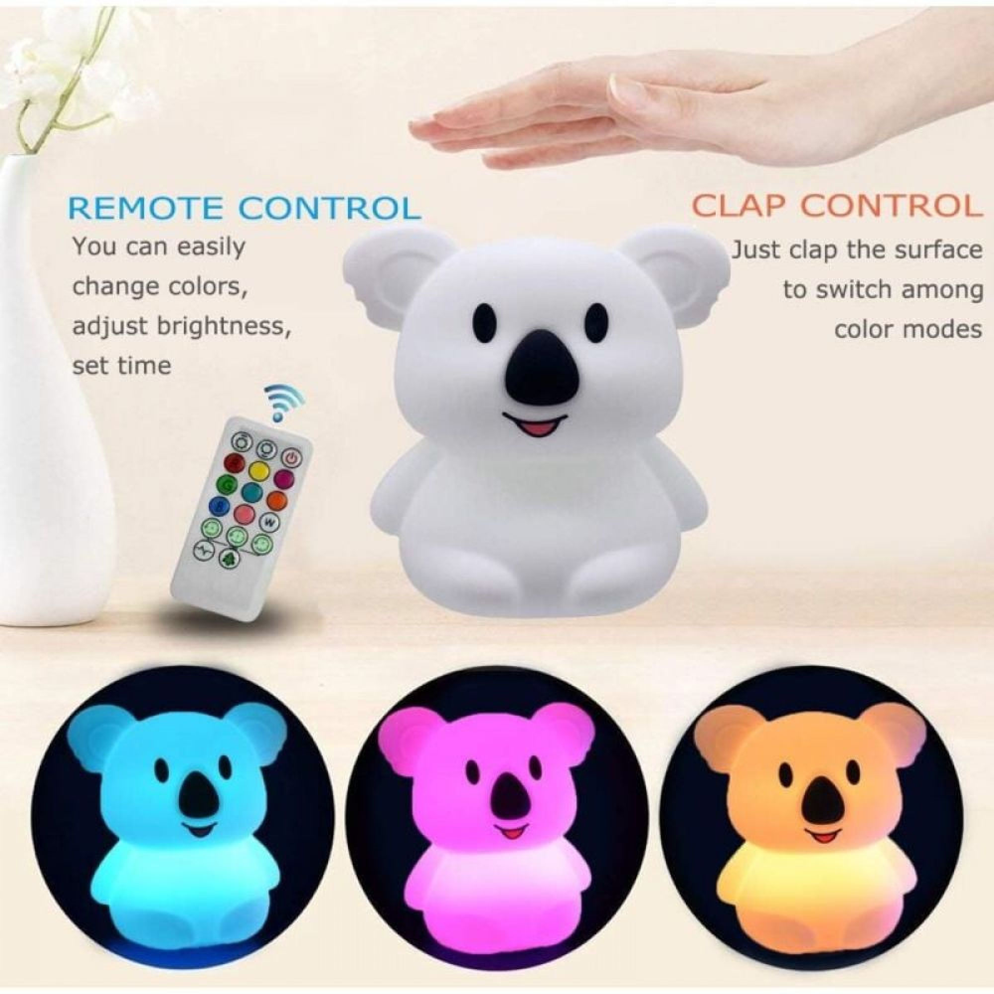 Ein Koala-Nachtlicht leuchtet in Blau, Rosa und Orange. Fernbedienung und Hand sind sichtbar.