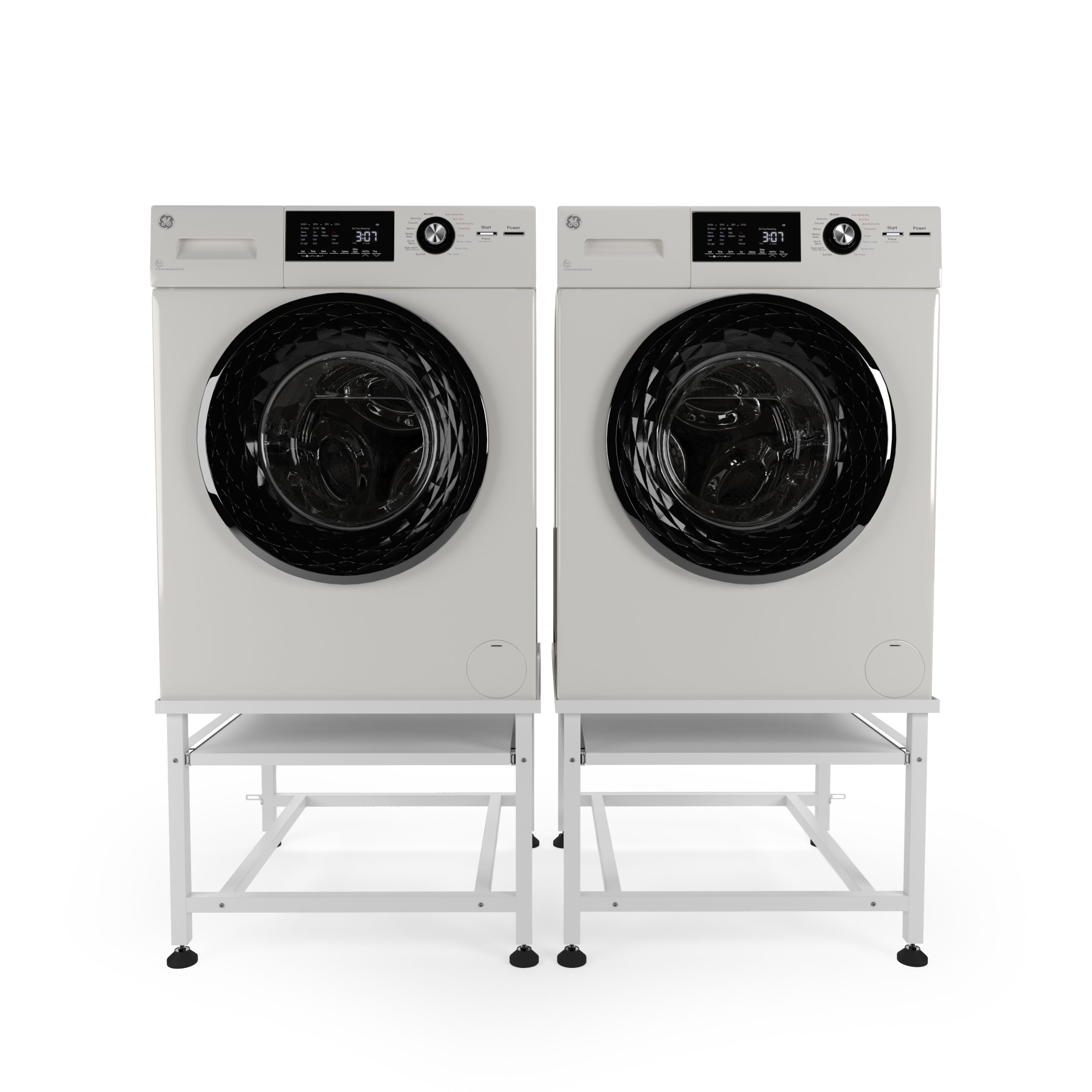 Two white GE washing machines with black doors stand side-by-side on white pedestals.