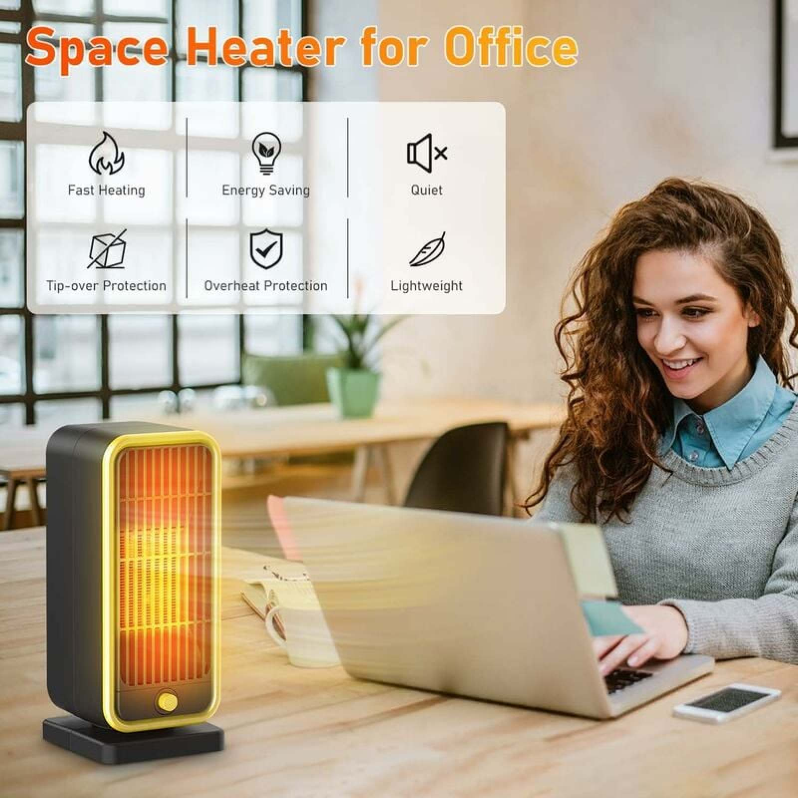 Ein schwarzer Heizlüfter mit goldenem Rand steht auf einem Tisch vor einer Frau mit Laptop.