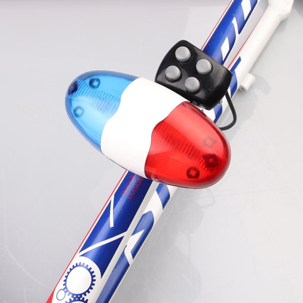 Ein rotes, blaues und weißes Fahrradlicht mit schwarzer Taste ist am Fahrradrahmen montiert.
