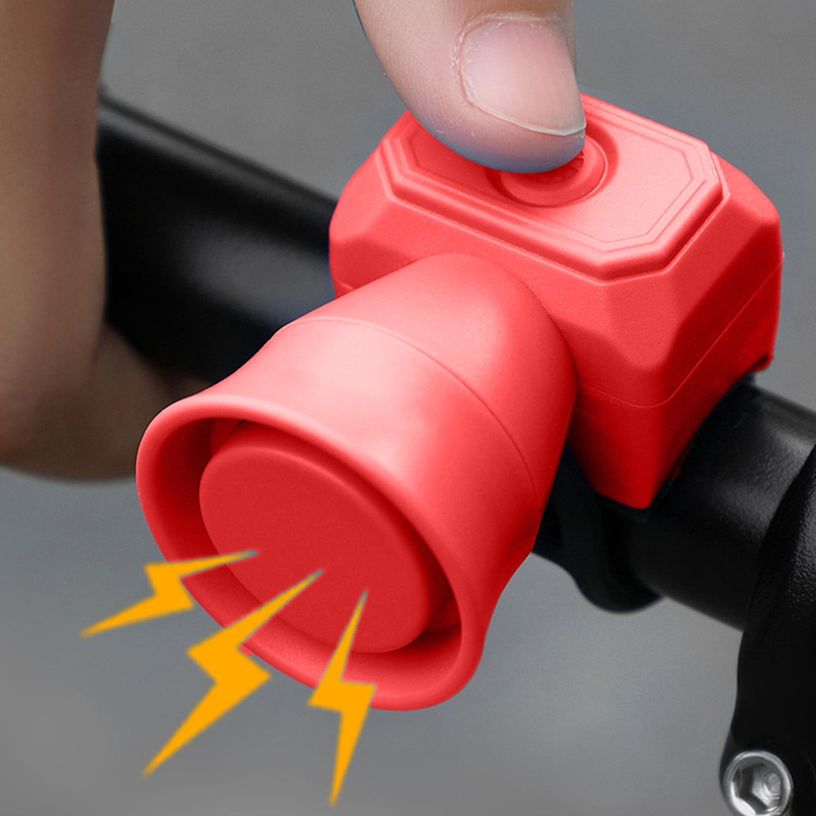 Rote Fahrradklingel wird von einem Finger gedrückt, mit gelben Blitz-Symbolen.
