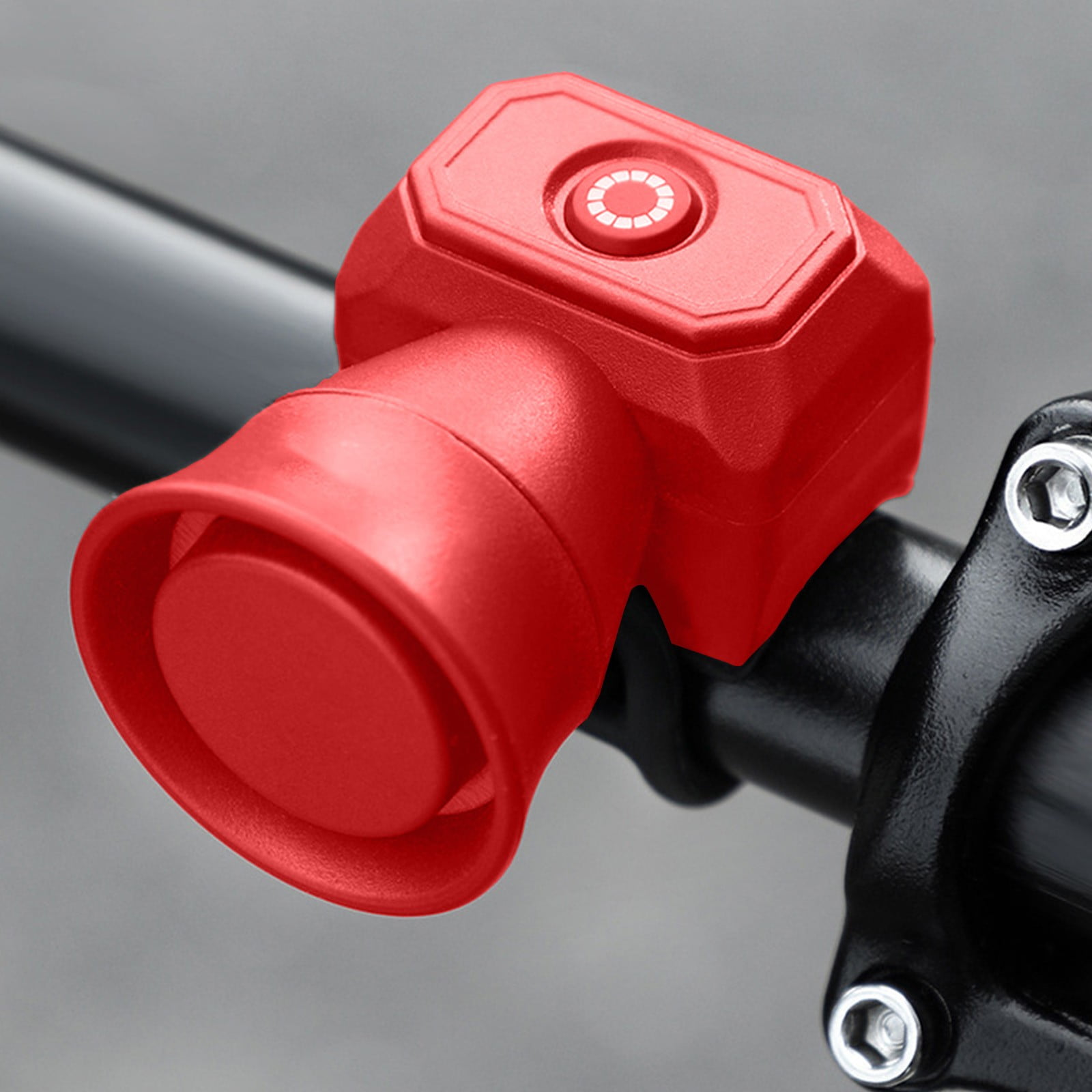 Rote Fahrradklingel mit Knopf, montiert an einem schwarzen Lenker.