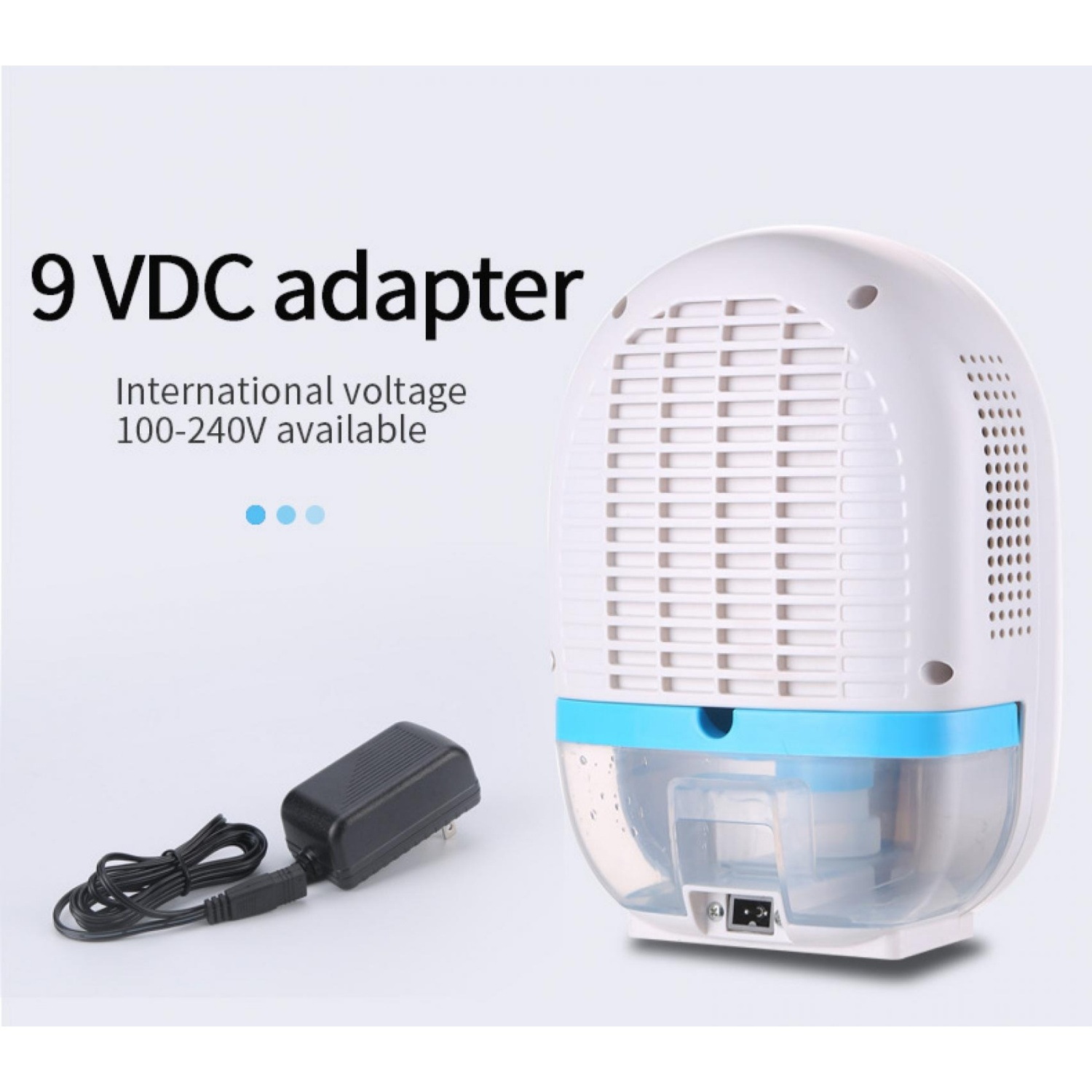 Ein weißer Luftentfeuchter mit blauem Akzent und ein schwarzer 9-VDC-Adapter daneben.