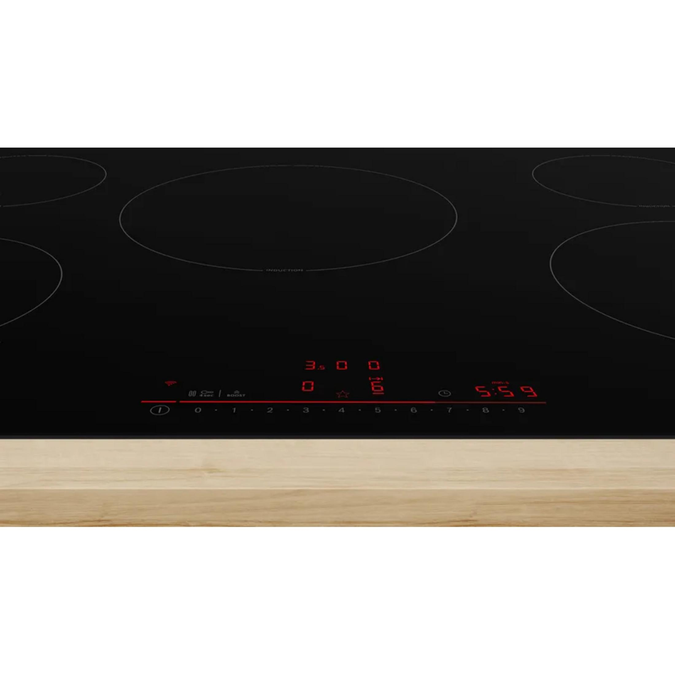 A black induction cooktop with red digital displays for time and power settings.
