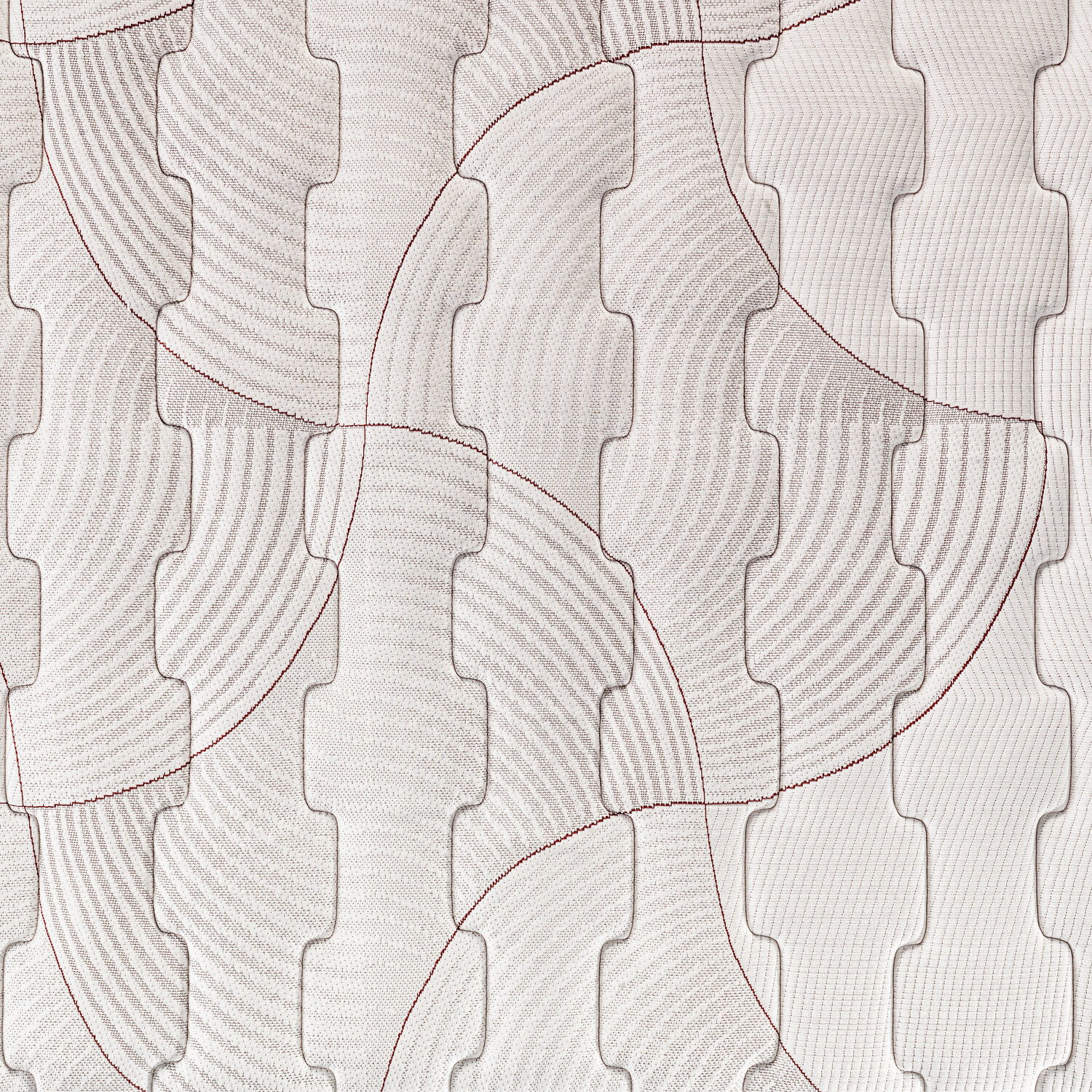 Patrón abstracto en tela blanca con líneas rojas y formas en relieve.