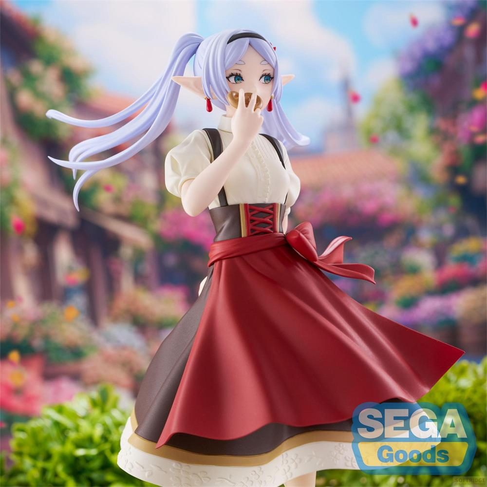 Figurine d'anime aux cheveux violets et oreilles d'elfe mangeant un biscuit.