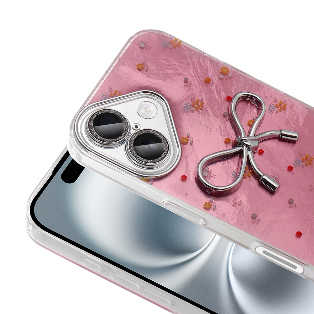 Çiçek desenli pembe telefon kılıfı, kamera lensleri ve fiyonk şeklinde halka tutucu.