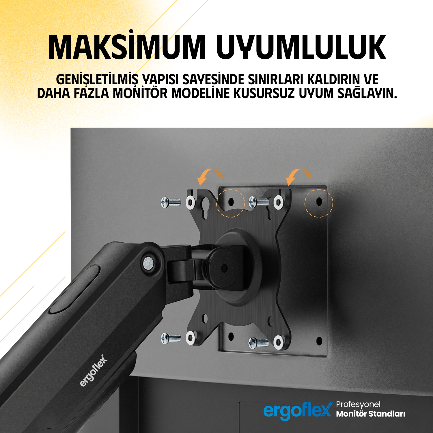 Gümüş vidalarla VESA yuvasına takılmış siyah monitör kolu.
