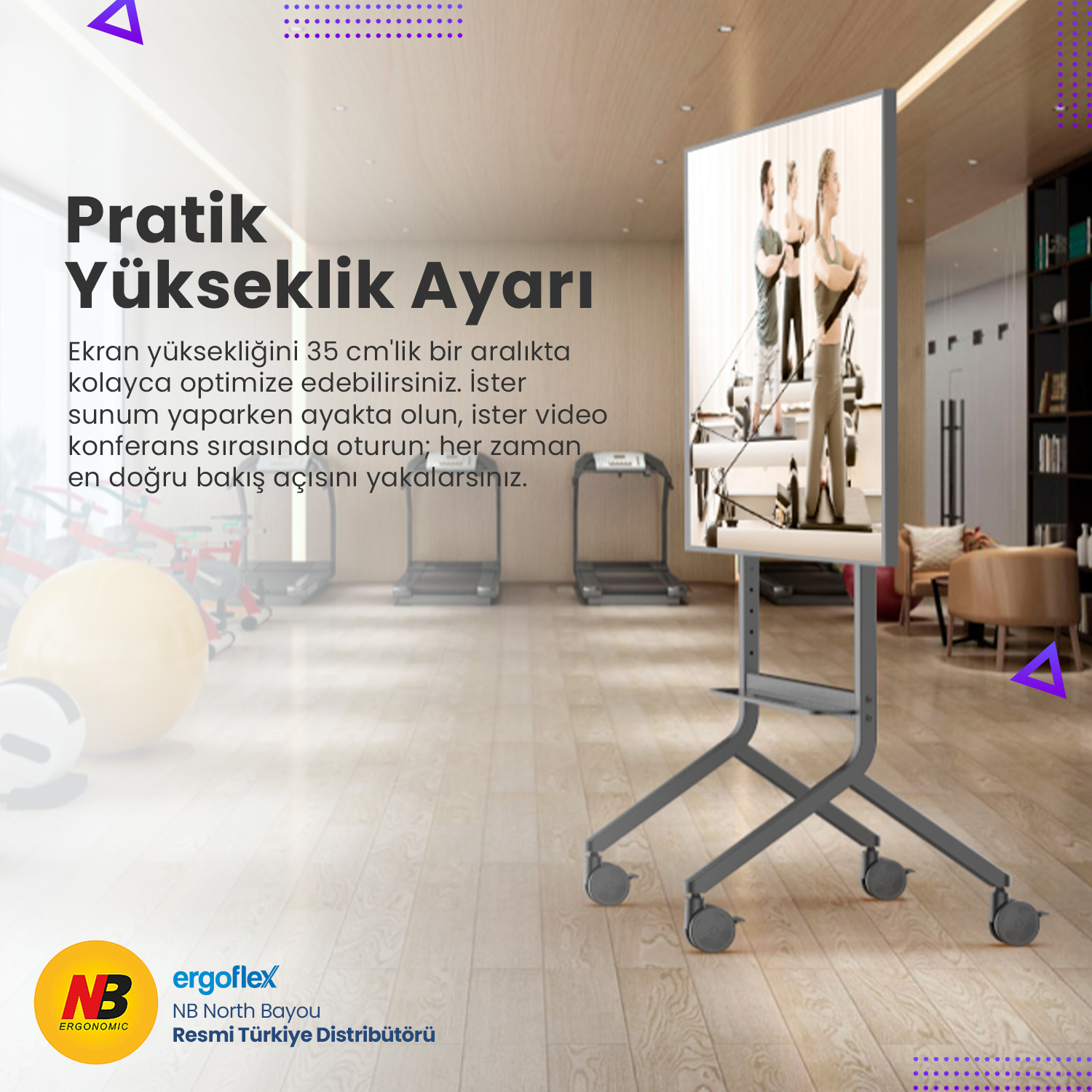 Fitness salonunda tekerlekli, yükseklik ayarlı monitör standı.