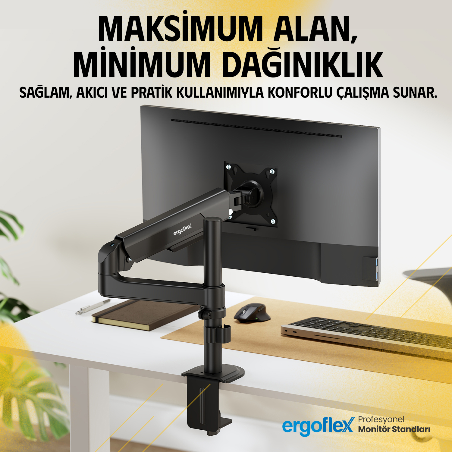 Siyah monitör kolu, klavyeli ve fareli bir masanın üzerinde siyah bir monitörü tutuyor.