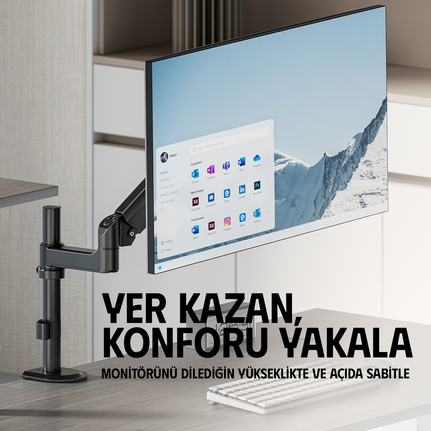 Bir monitör kolu, Windows menüsü gösteren modern bir bilgisayar ekranı tutuyor.