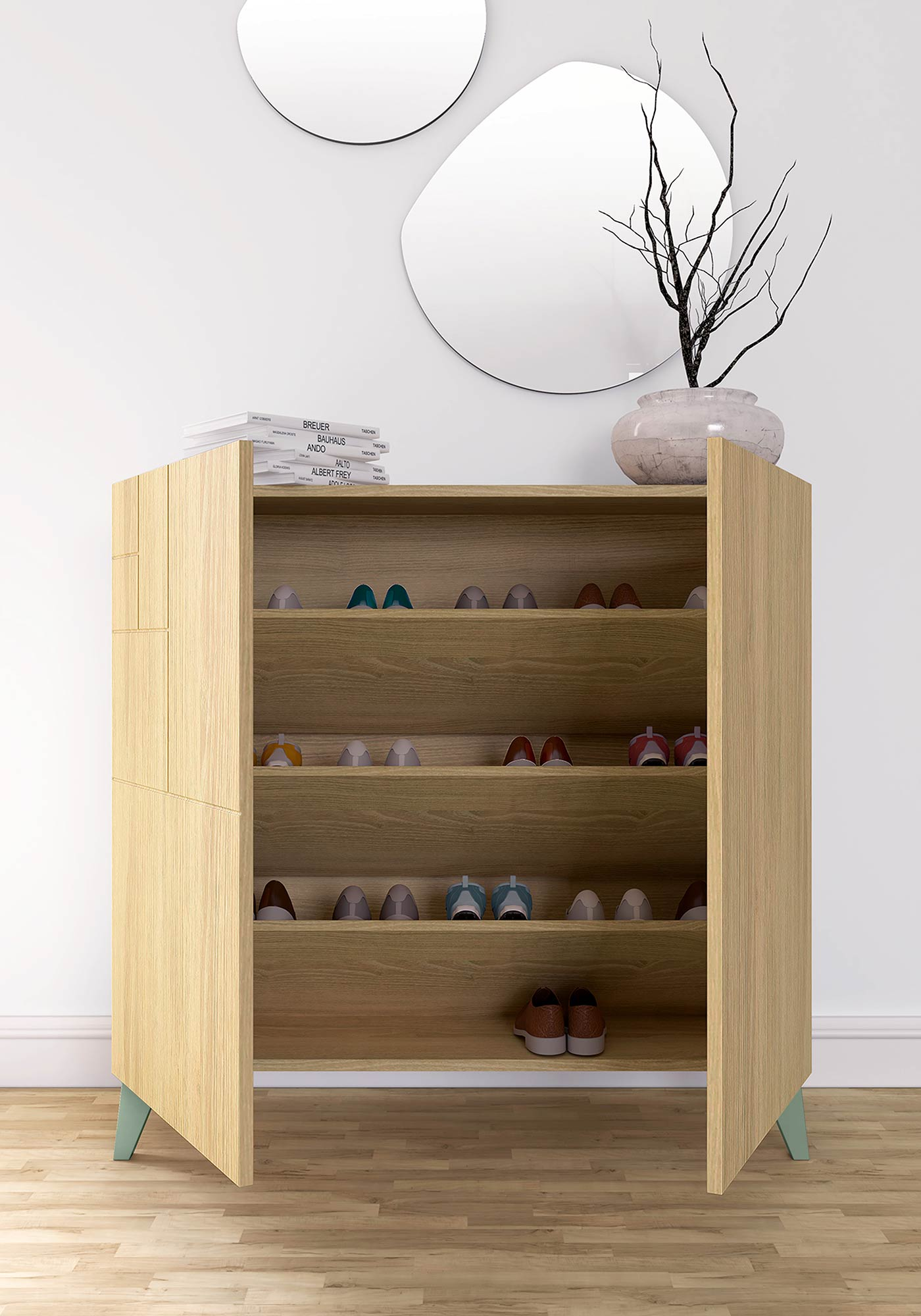 Un zapatero de madera clara con varios estantes, lleno de zapatos. Libros encima, junto a un jarrón con ramas.