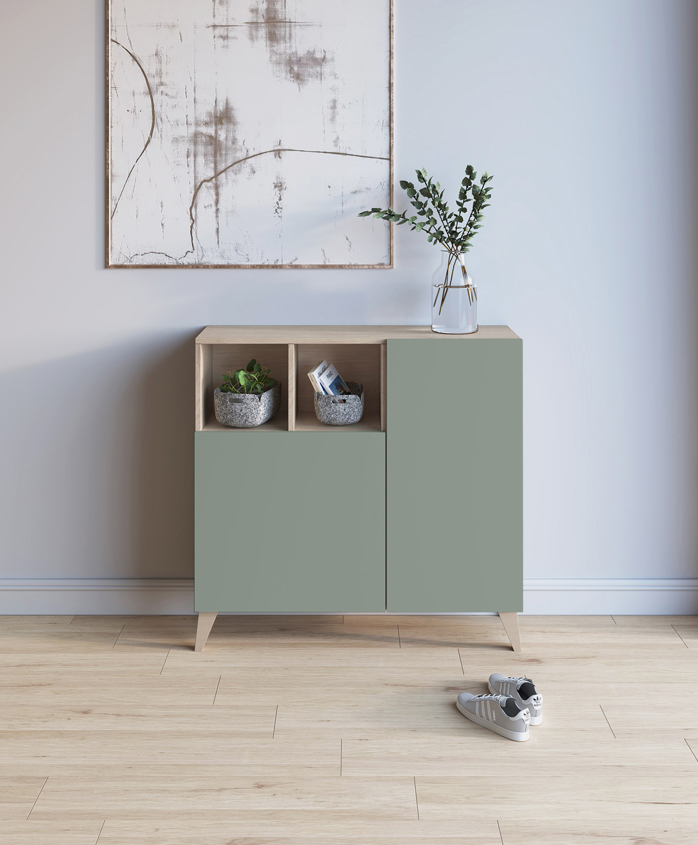 Gabinete verde salvia con tapa de madera, arte encima y plantas. Zapatos en el suelo.