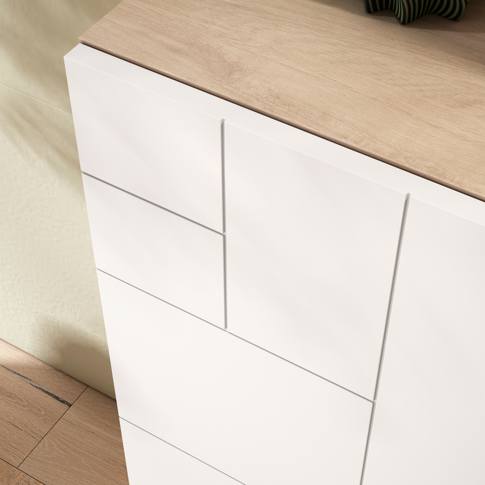 Frentes de cajón blancos con tapa de madera y sombra a la izquierda.