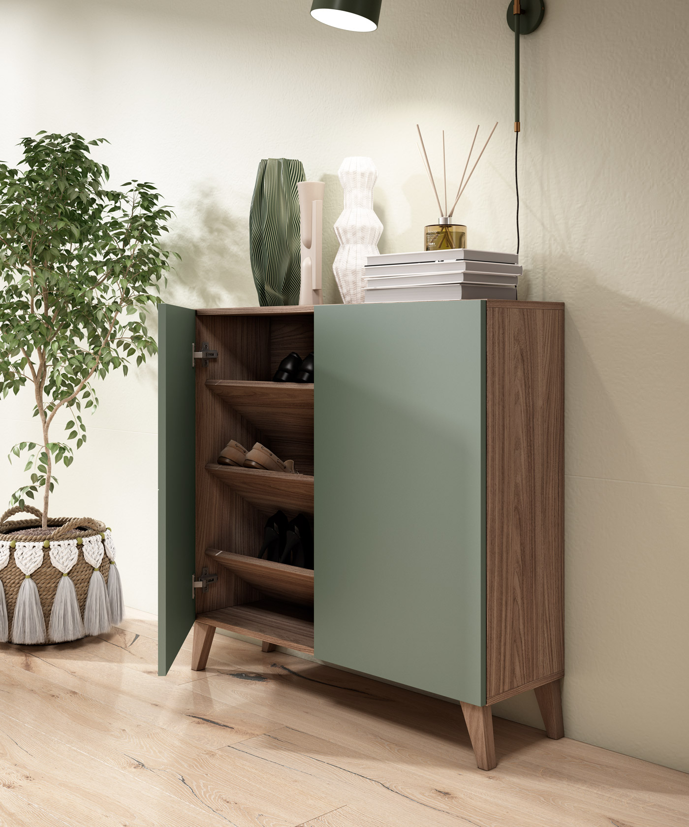 Un zapatero verde con detalles de madera, junto a un árbol verde en una cesta.