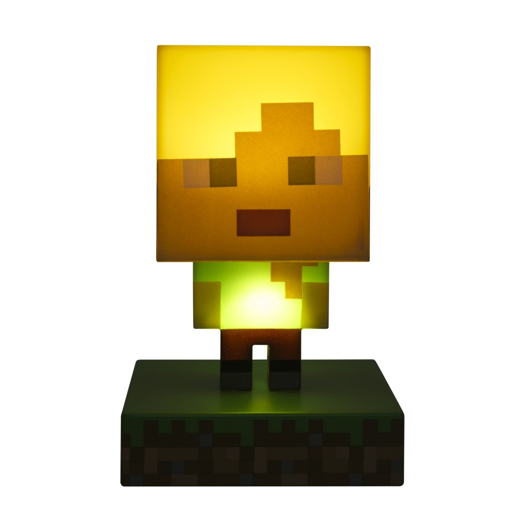 Lampa postaci Minecraft ze świecącym zielonym tułowiem na podstawie bloku trawy.
