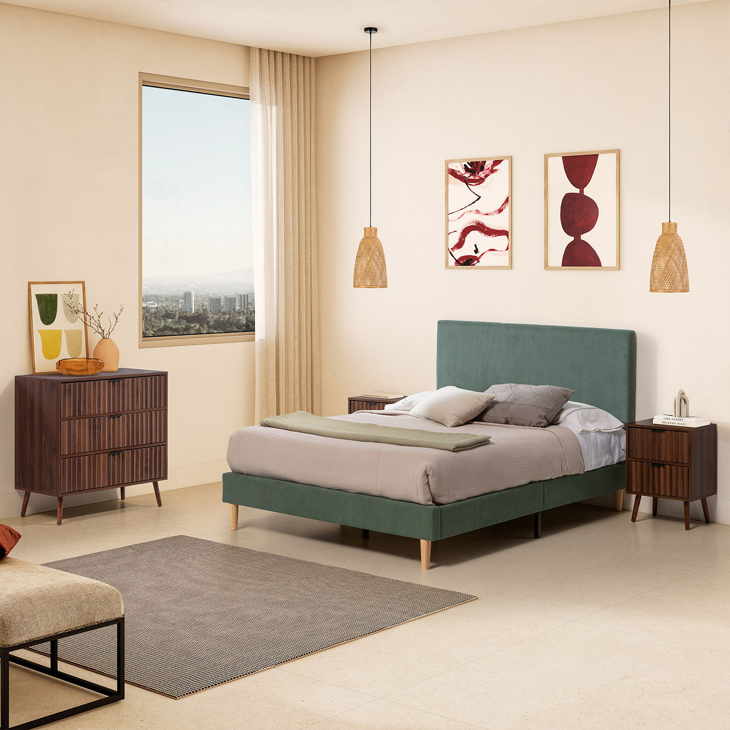 Un dormitorio con cama verde, cómodas de madera y arte en la pared.