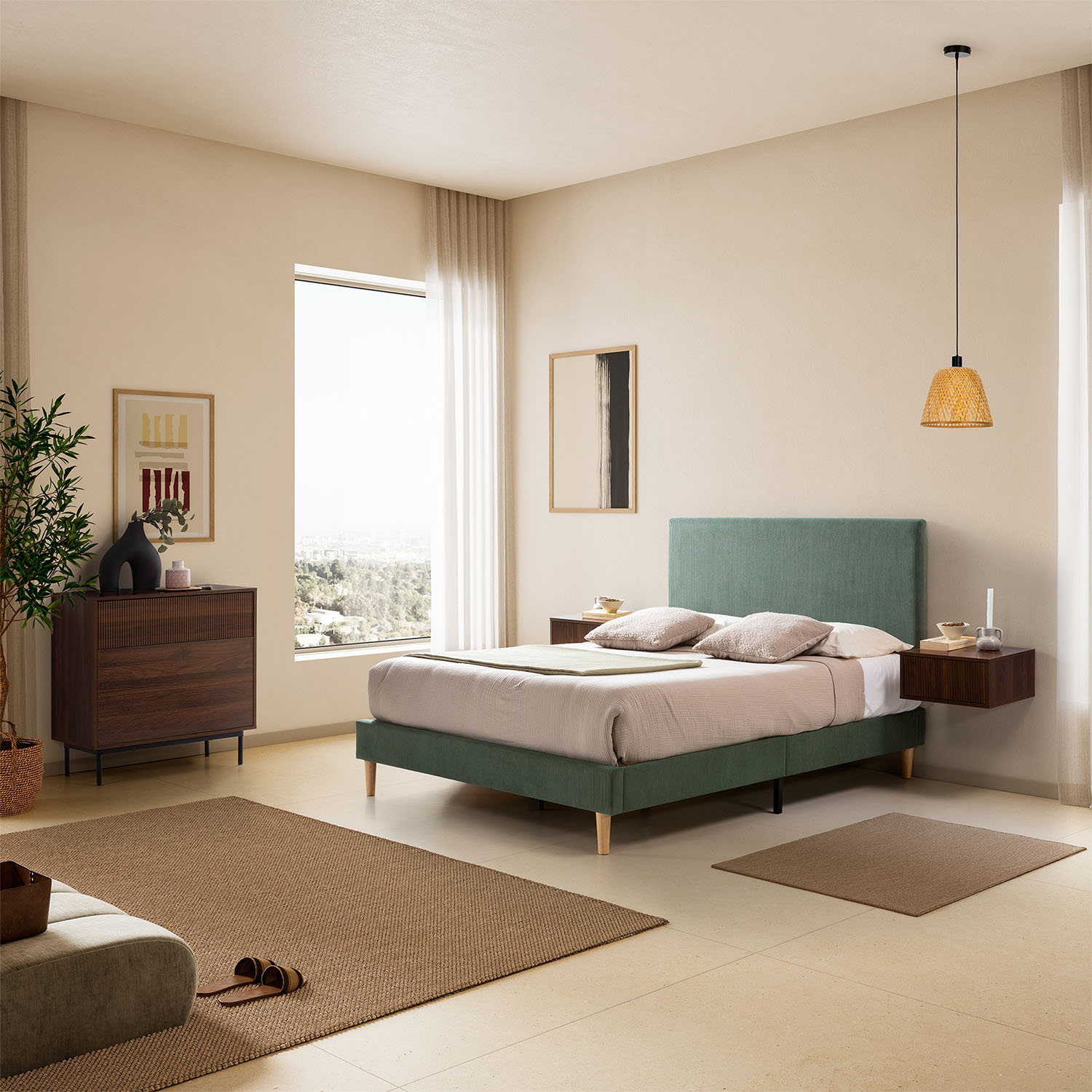 Un dormitorio moderno con cama verde, cómoda de madera y ventana.