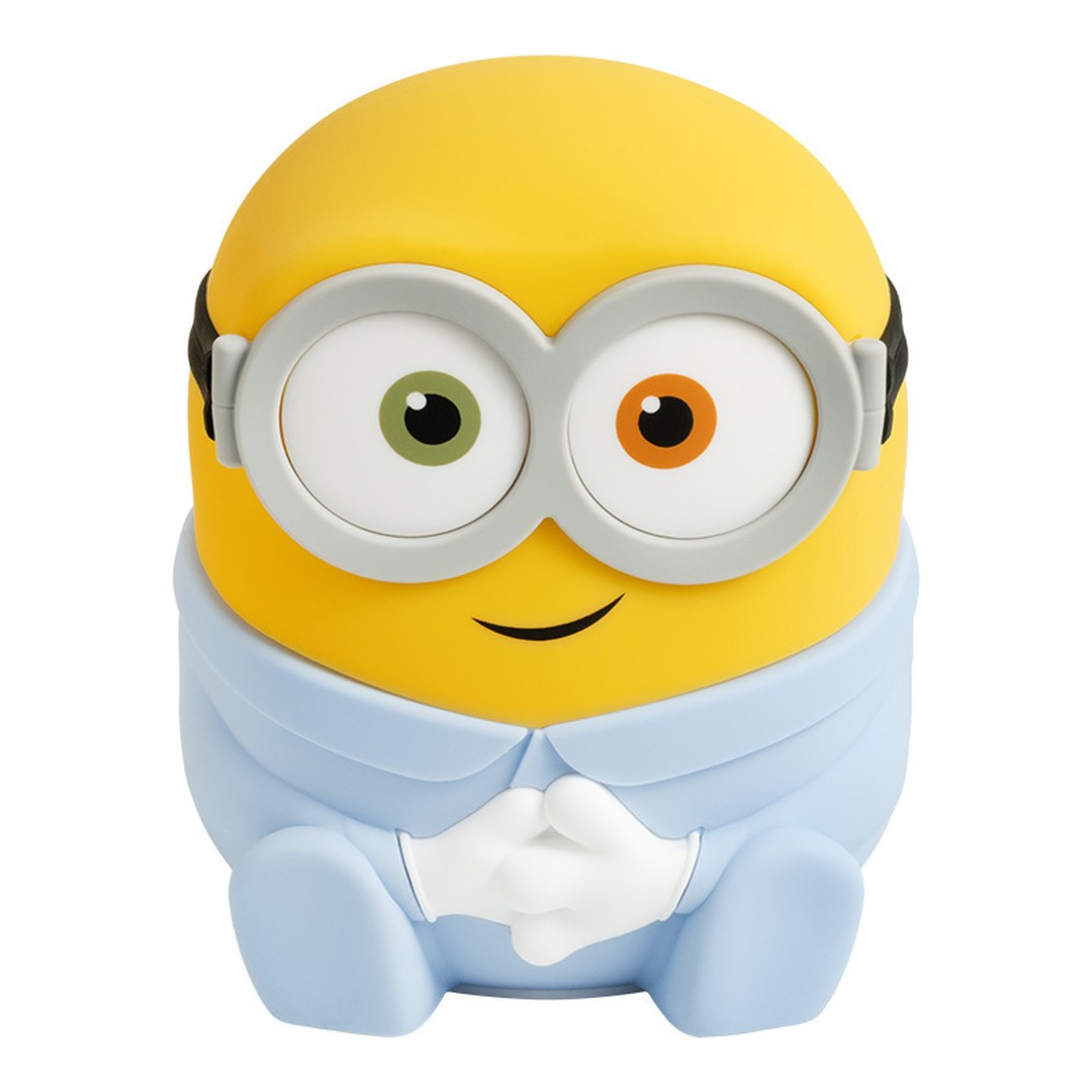 Żółta figurka Minionka w niebieskim ubranku niemowlęcym z dwoma różnymi oczami.