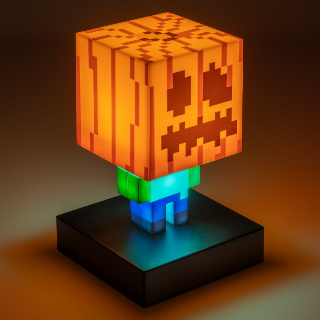 Lampa dynia Minecraft z świecącym korpusem na czarnej podstawie.