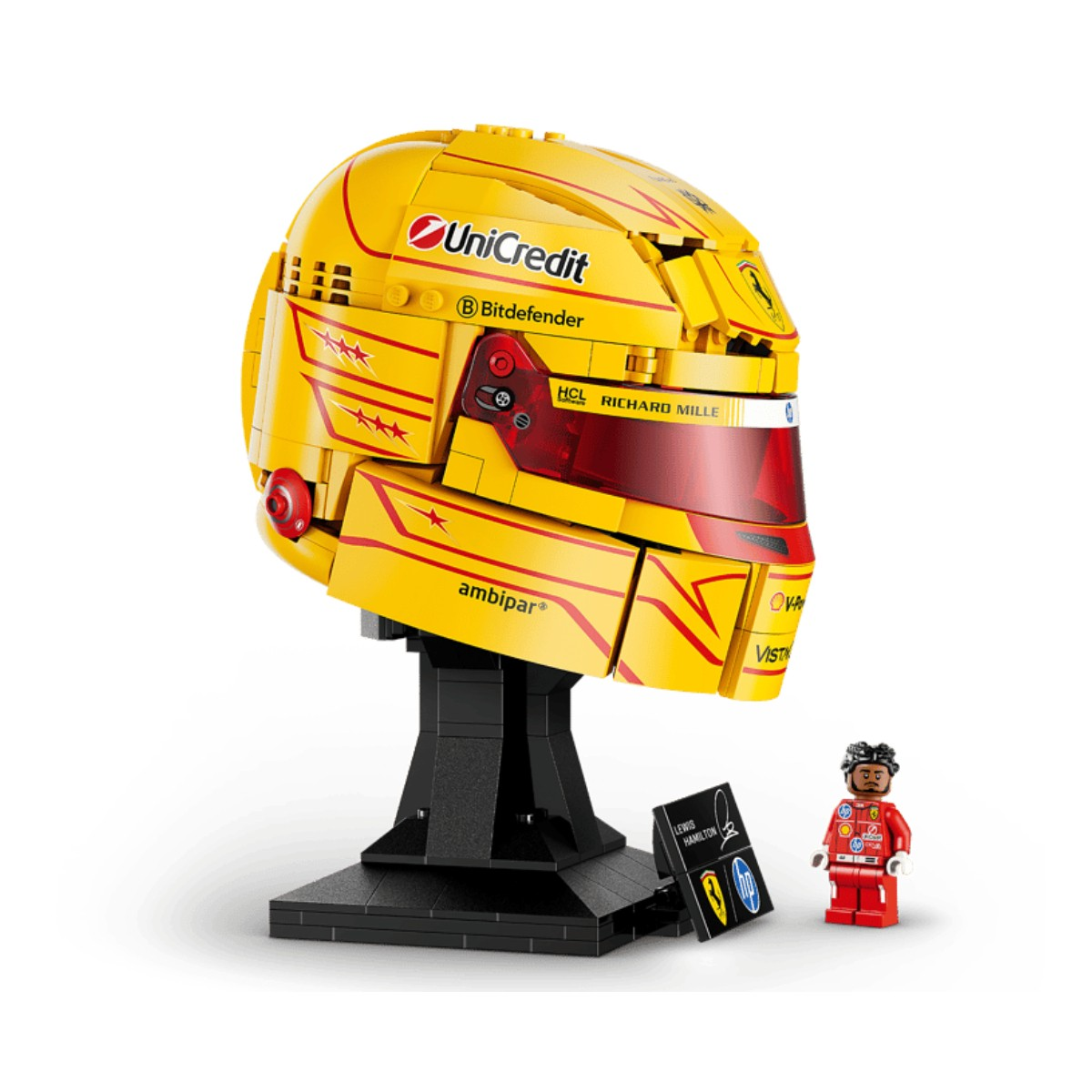 Kırmızı vizörlü sarı Lego kask, stant ve figür.
