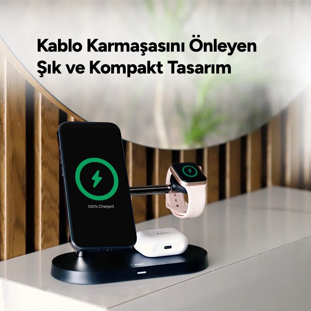 iPhone, Apple Watch ve AirPods için siyah şarj istasyonu. iPhone %100 şarj gösteriyor.