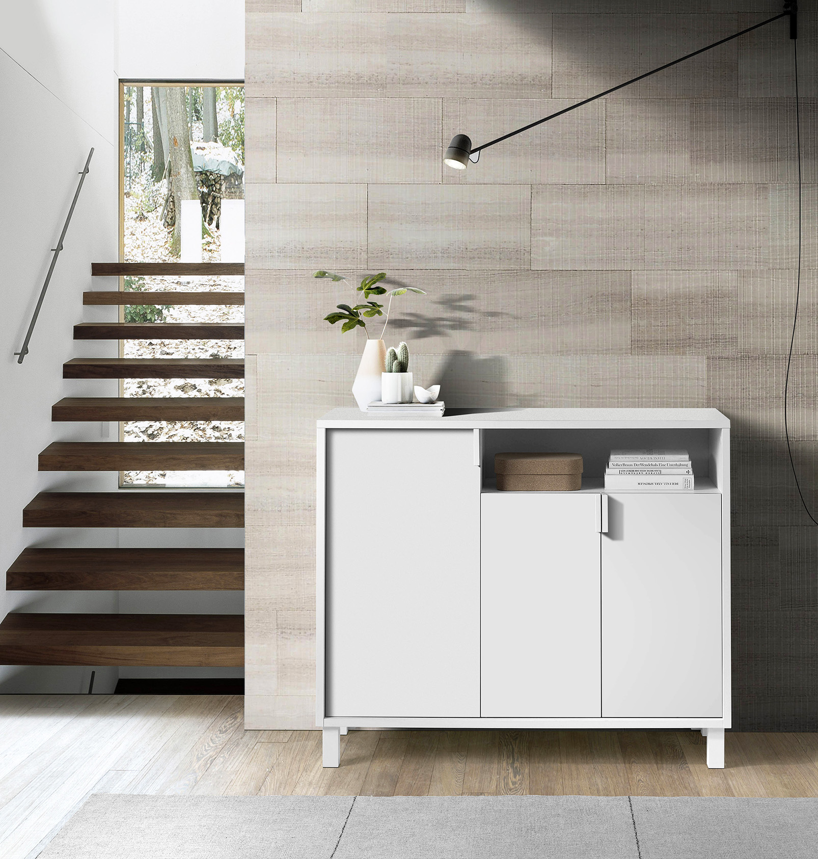 Un mueble blanco junto a una escalera de madera y una pared con detalles de madera.