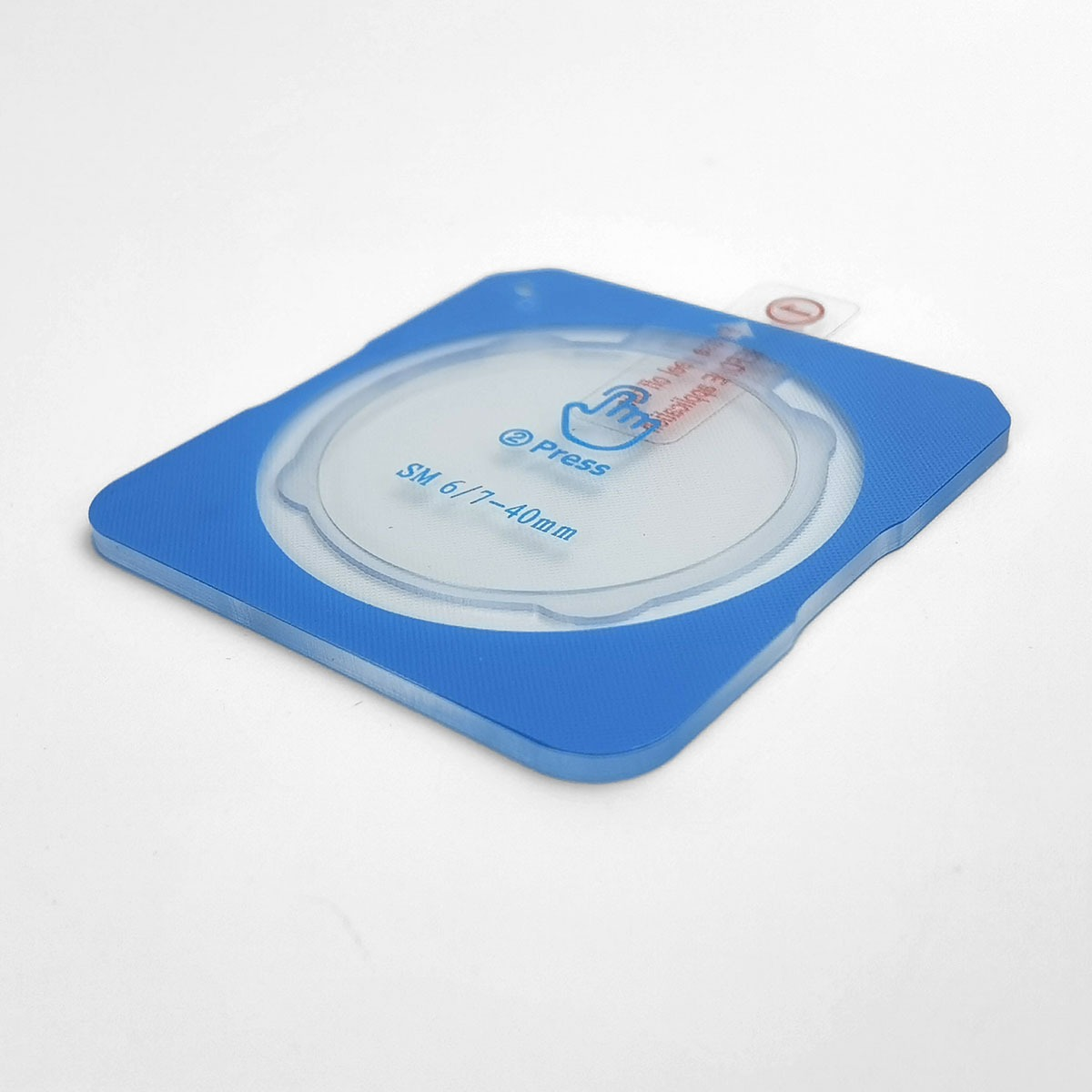 Supporto blu con oggetto rotondo e trasparente. Testo 'Press'.