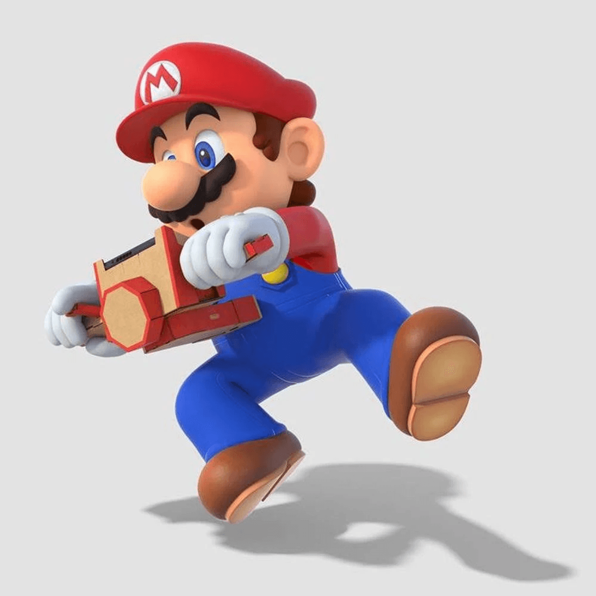 Mario in Rot, Blau und Braun hält eine Kiste mit roten Akzenten.
