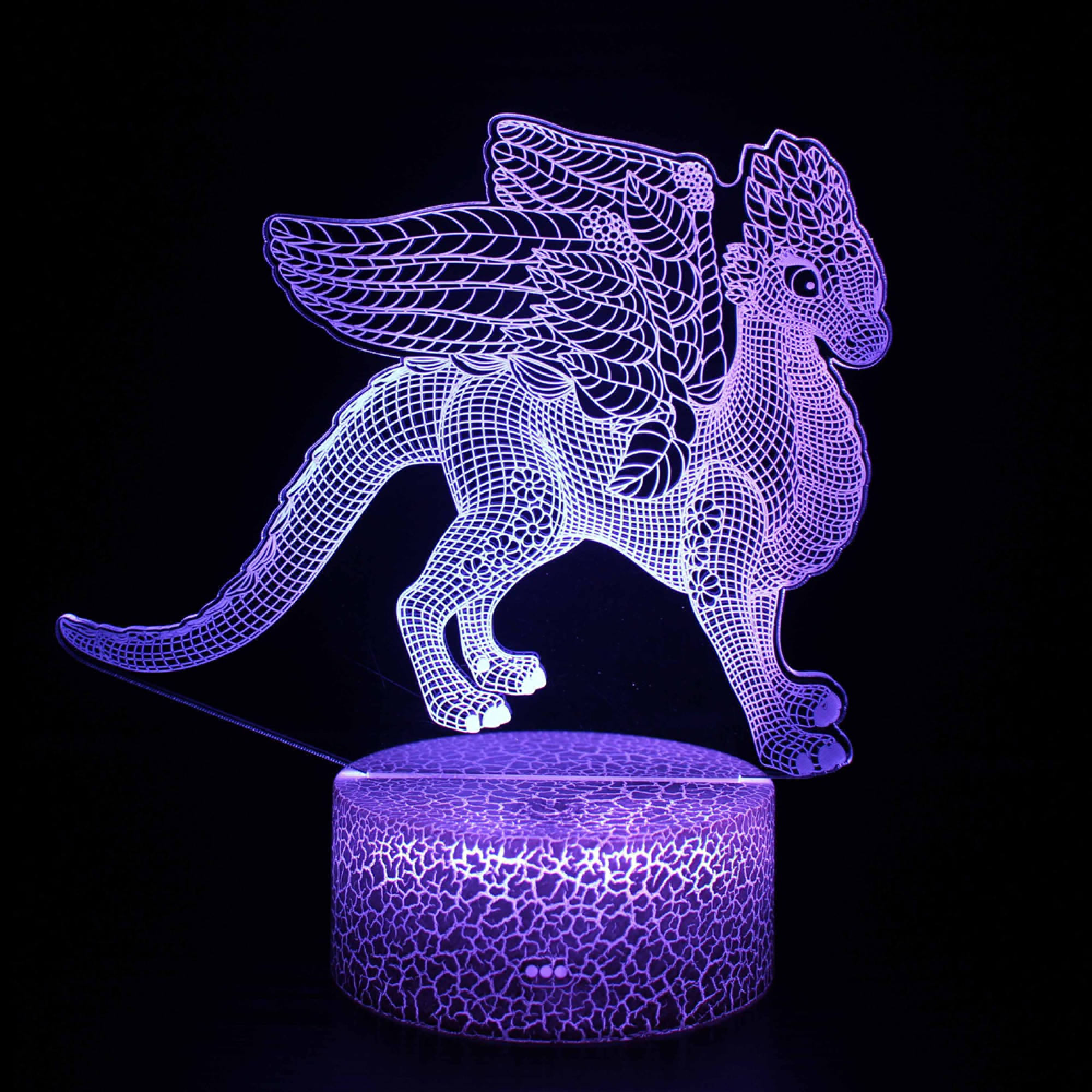 Eine lila LED-Lampe in Form eines geflügelten Drachen auf strukturiertem Sockel.